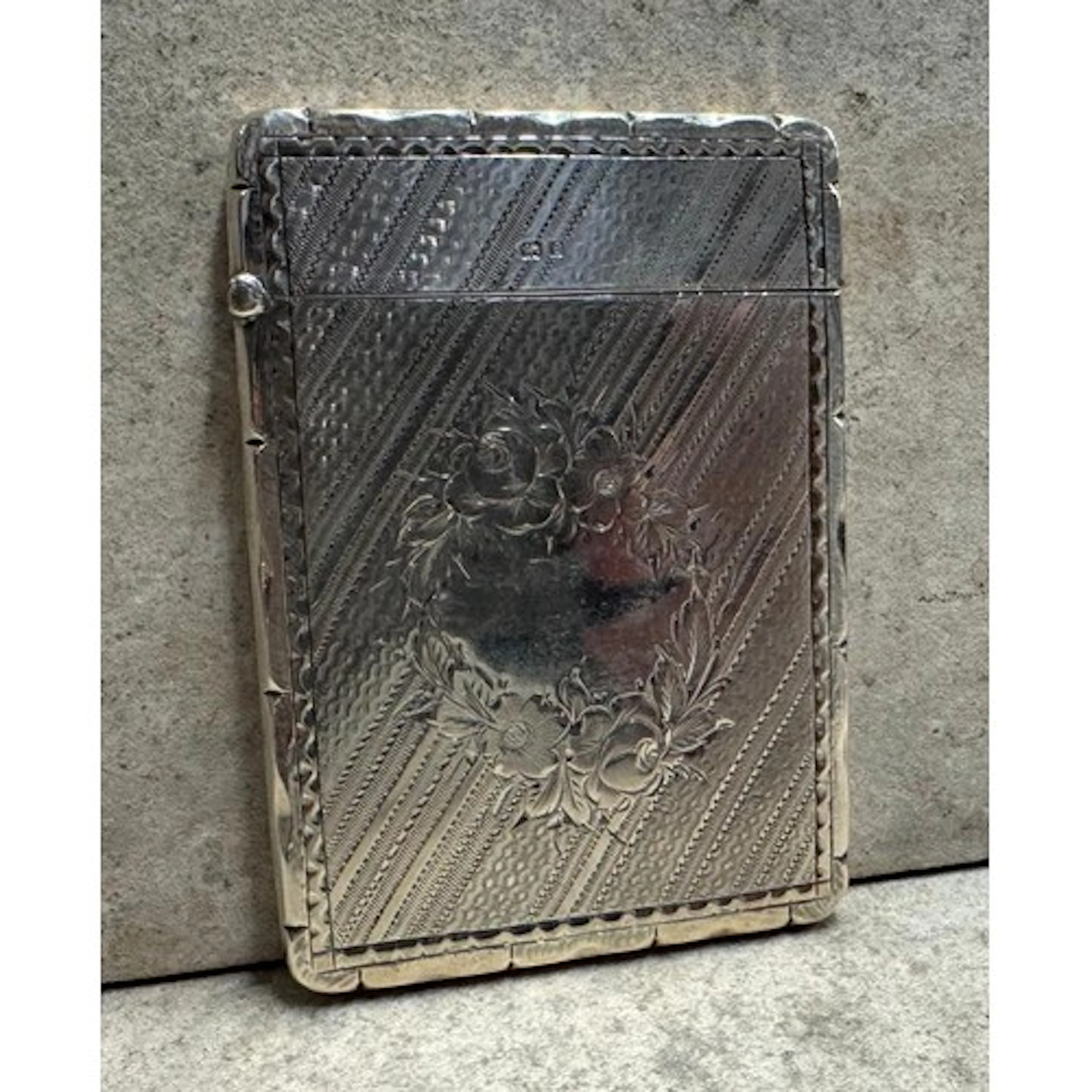 An engraved silver card case. Birmingham 1904. By Joseph Glo...