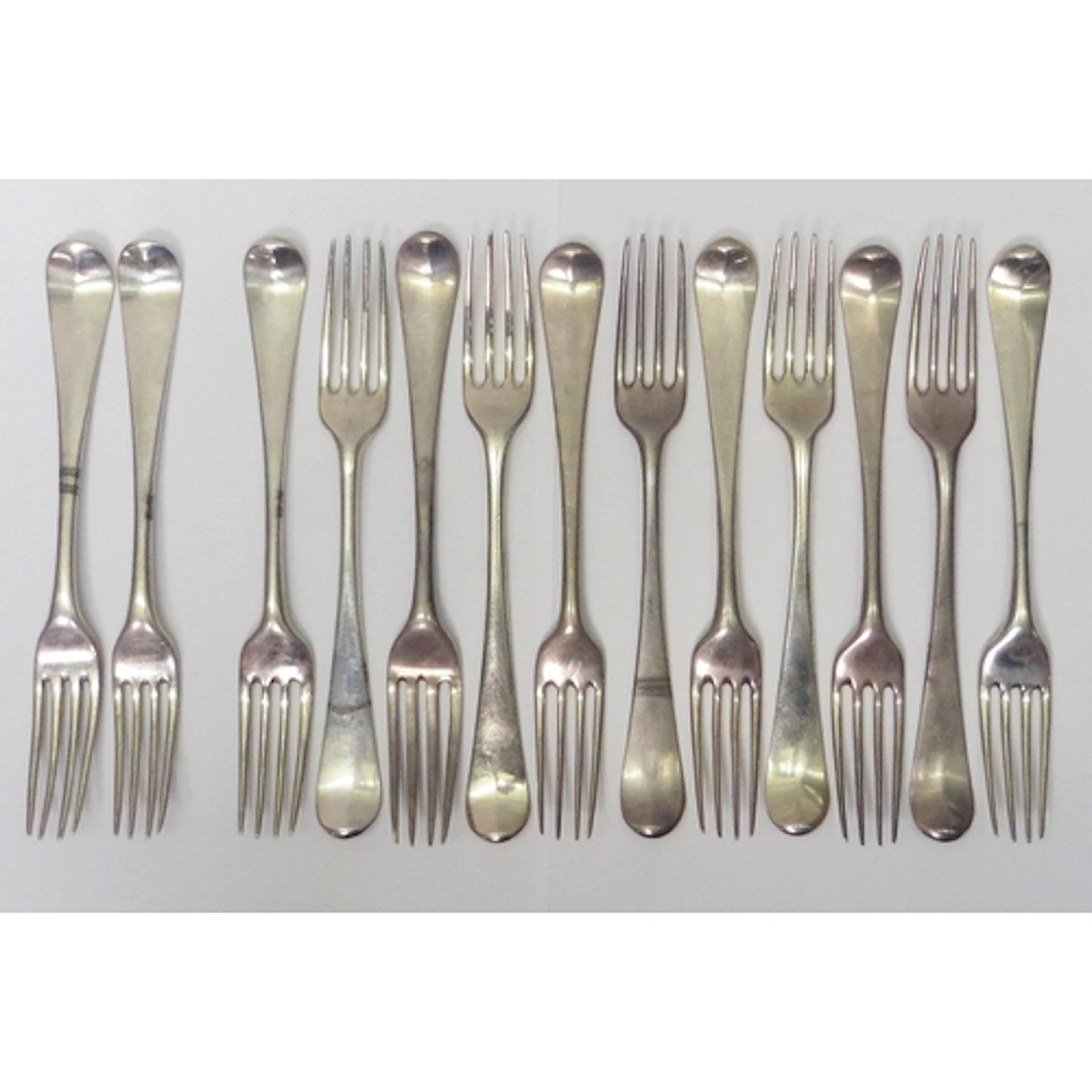 A matched set of eleven George II & III silver Hanoverian pa...
