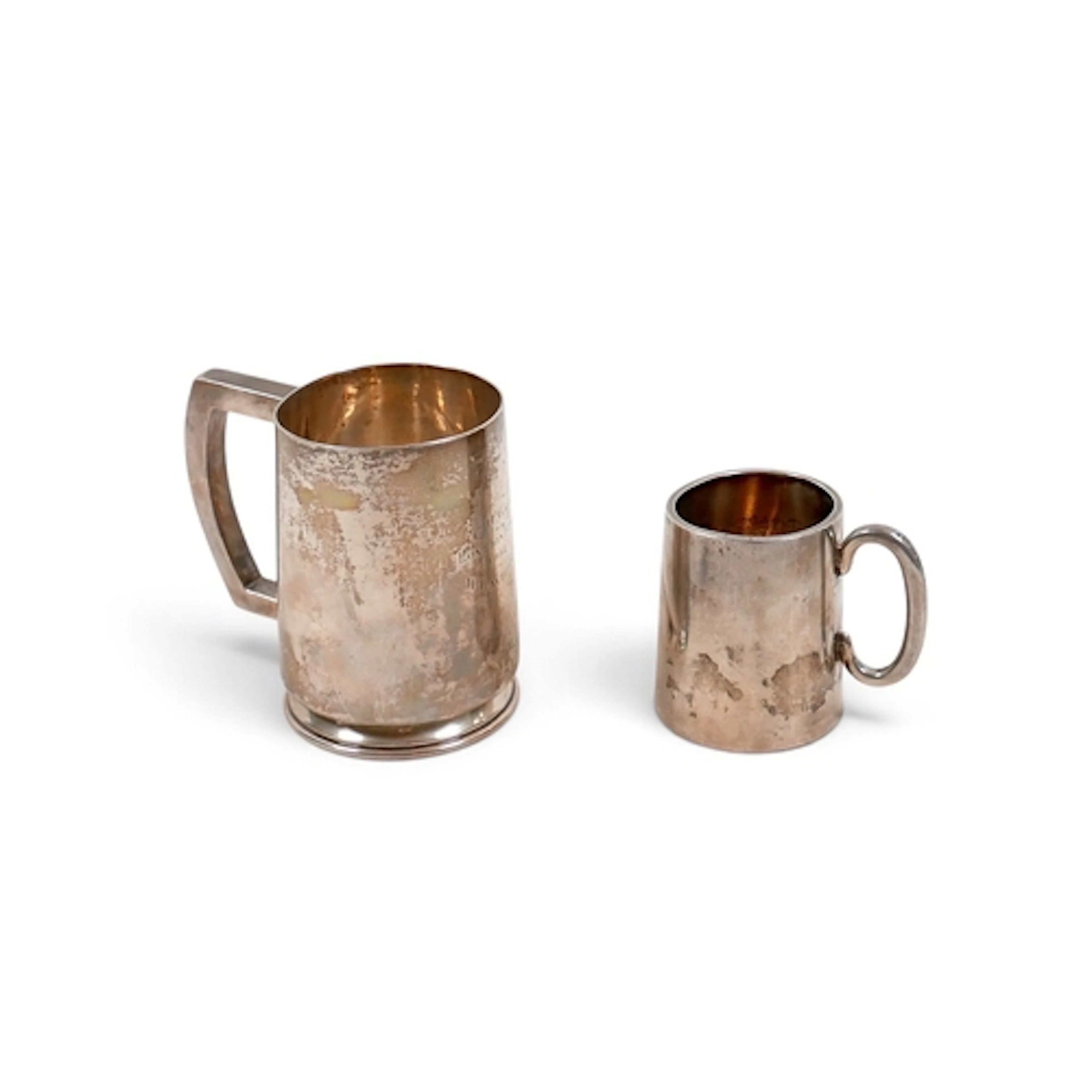 TWO SILVER TANKARDS. comprising a George V tankard William S...