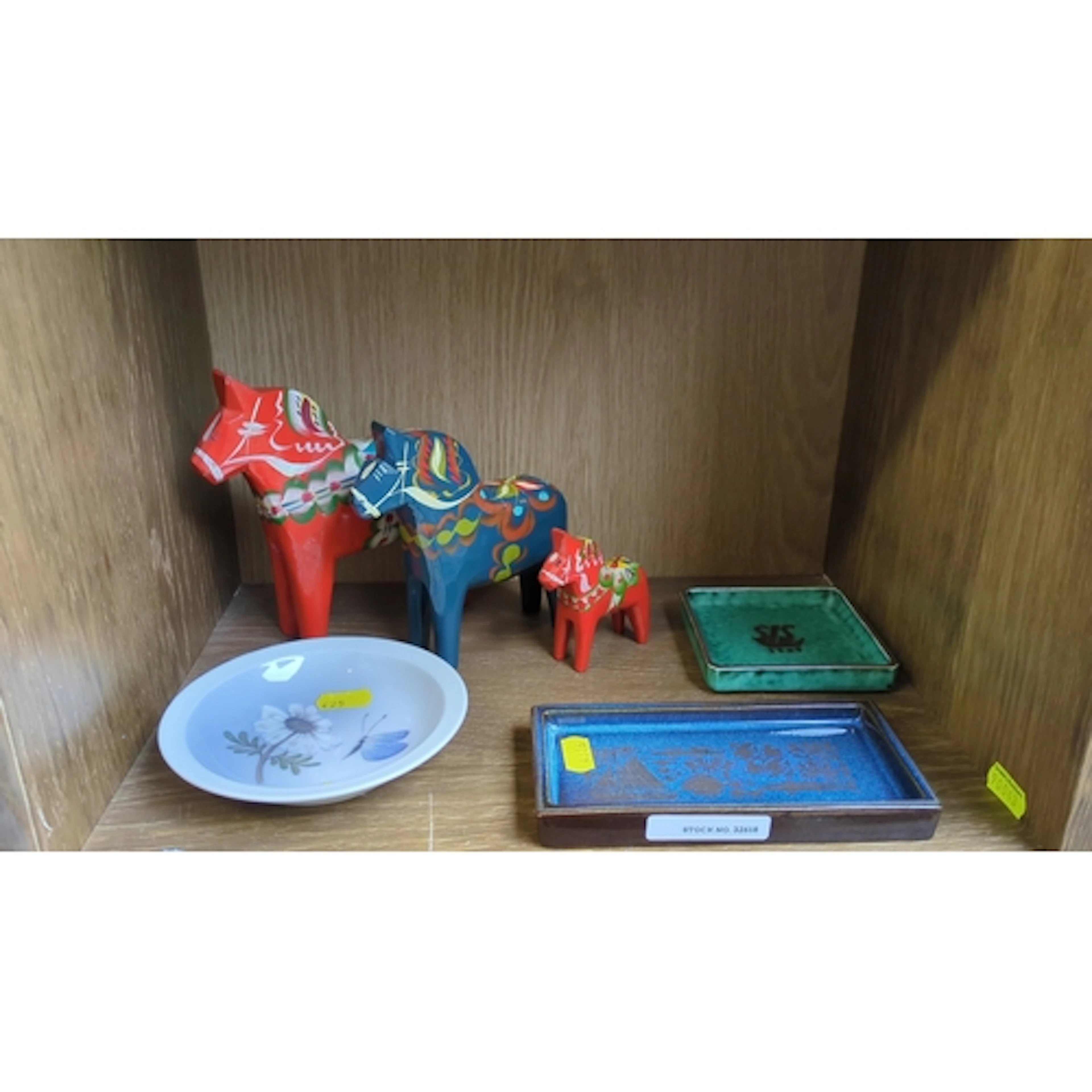 A mixed group including three Swedish painted wooden Dala ho...