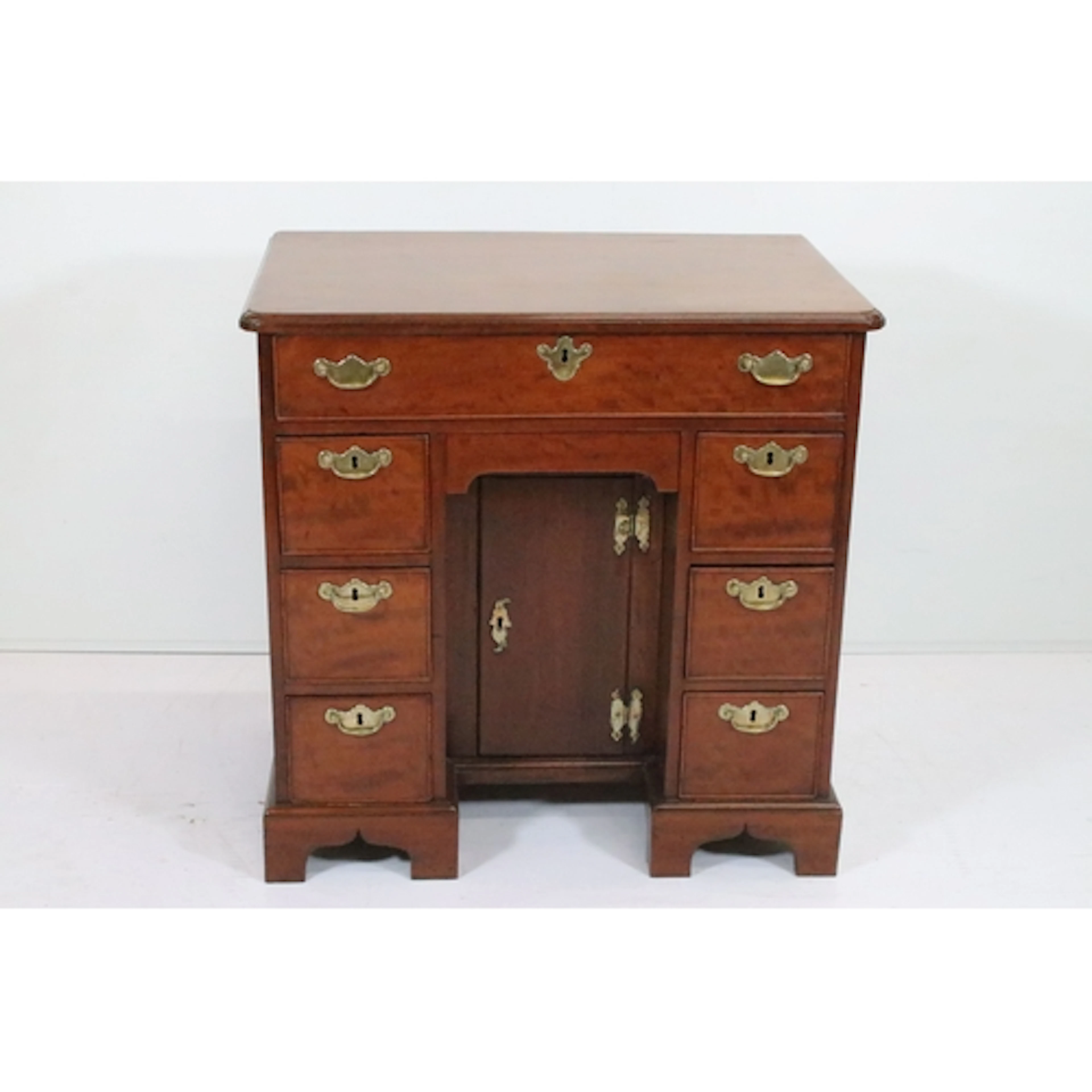 George II mahogany kneehole desk, having rectangular top wit...