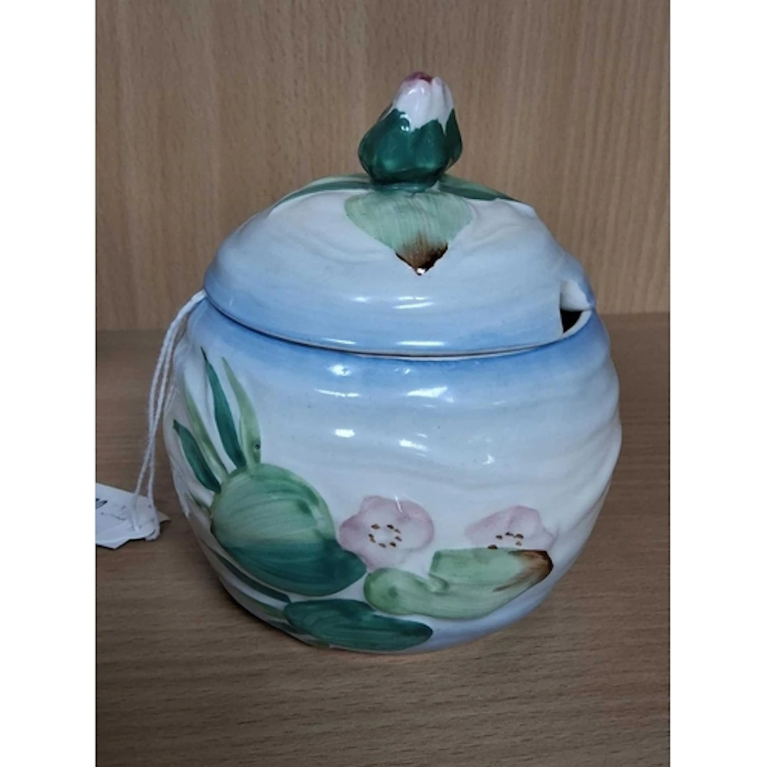 A CLARICE CLIFF WATER LILY PRESERVE POT, moulded with water ...