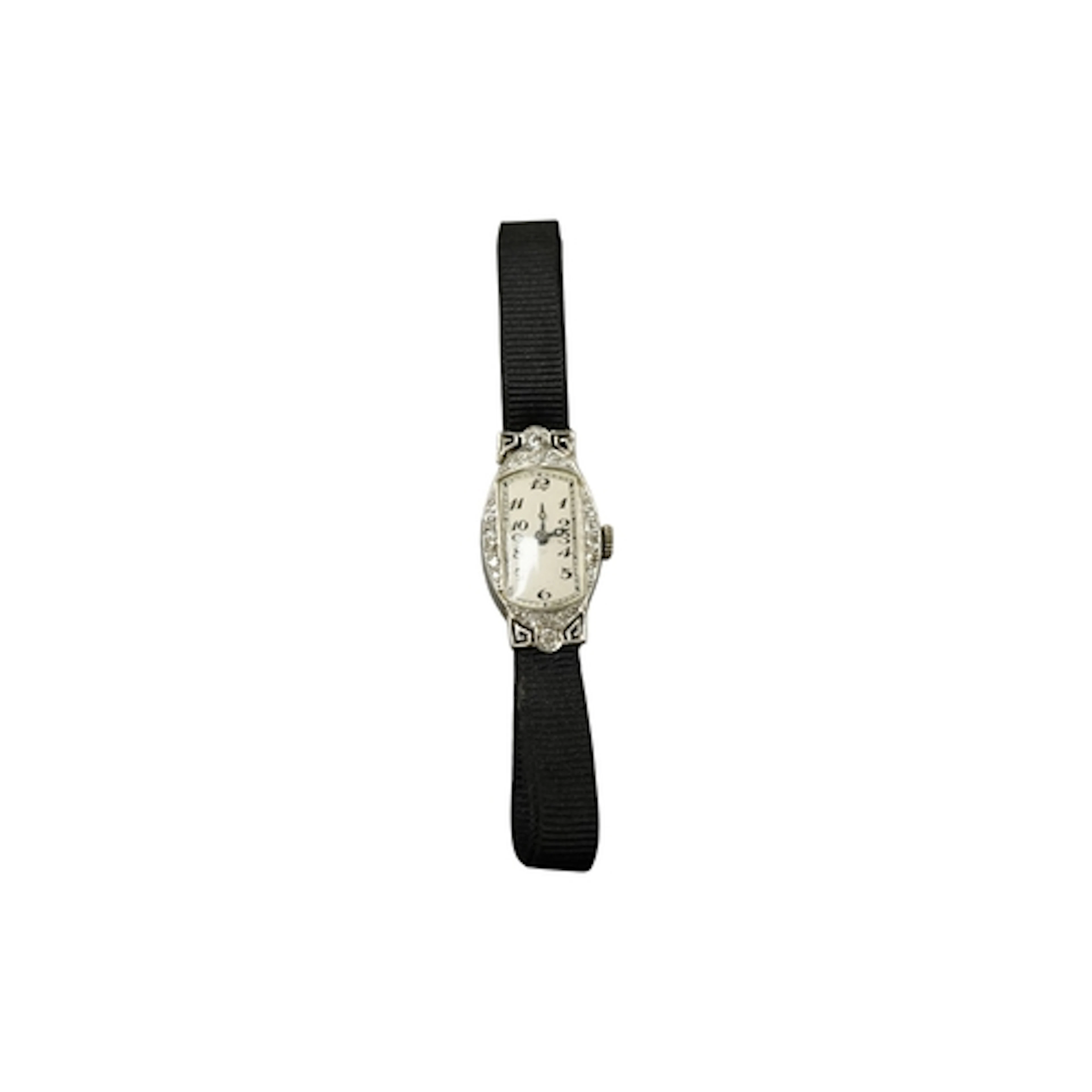 A mid 20th century white metal and diamond set cocktail watc...