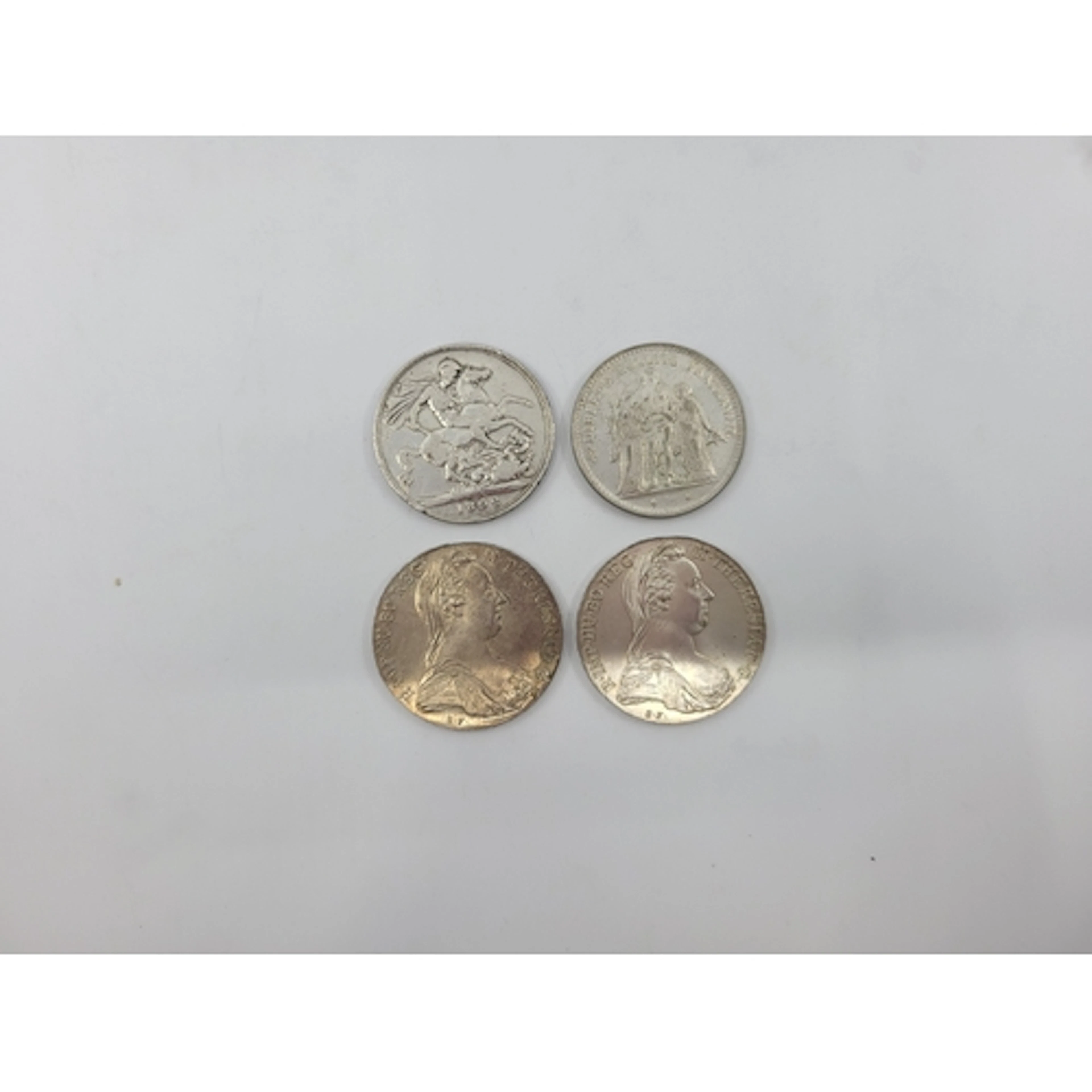 A COLLECTION OF FOUR SILVER COINS, to include 2 x Marie Ther...