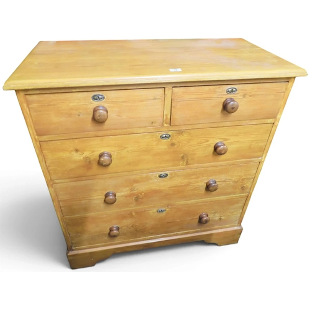 An early 20th century pine chest of drawers with two short o...