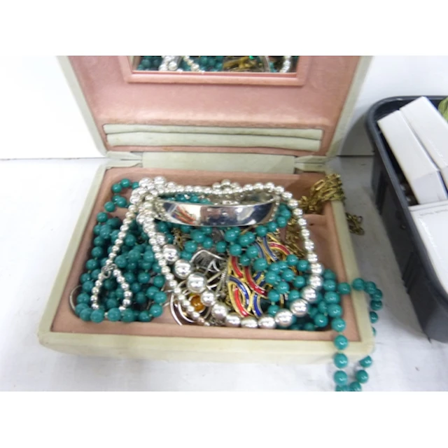 Two boxes of costume jewellery.