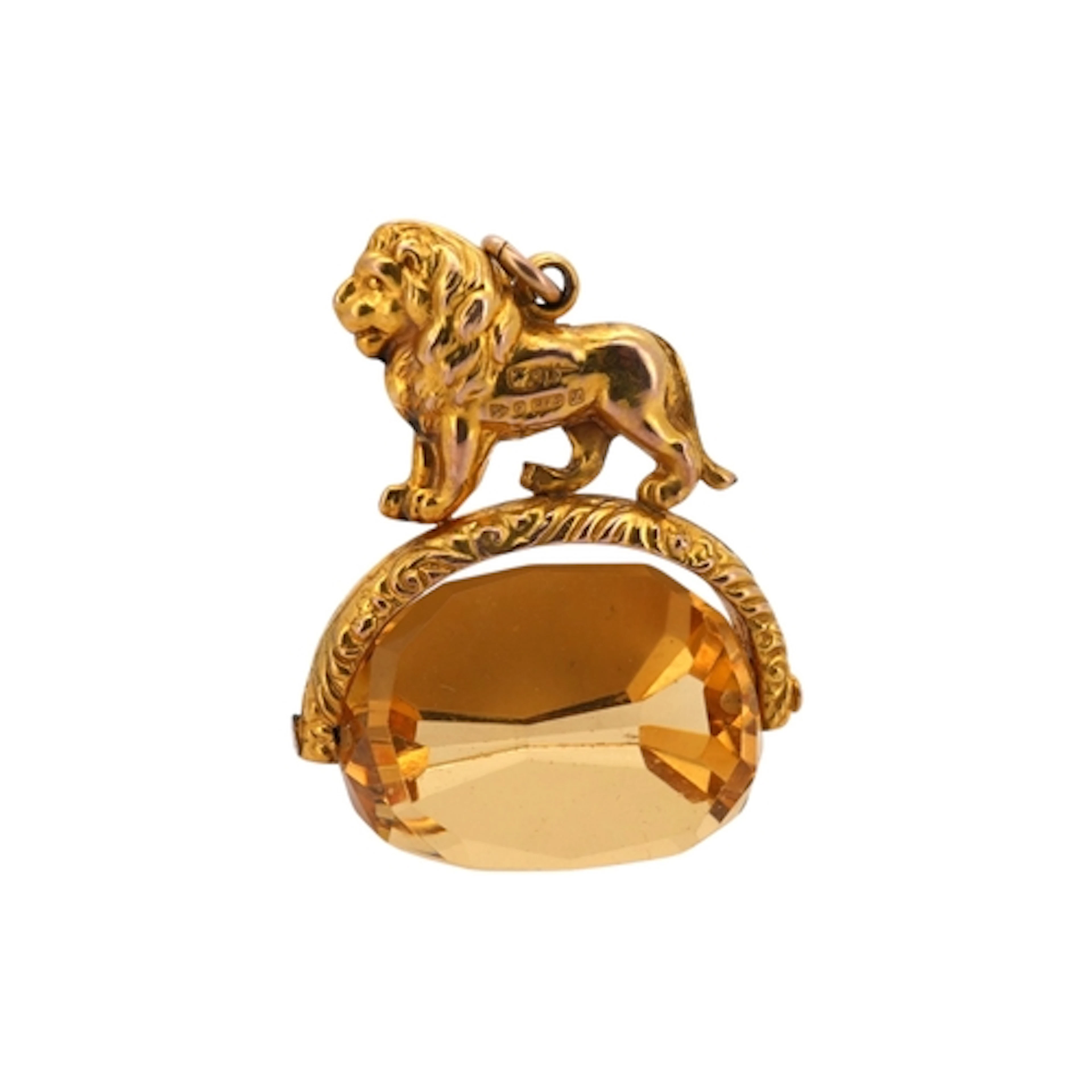 A gold and paste seal, circa 1911, surmounted by a lion, set...