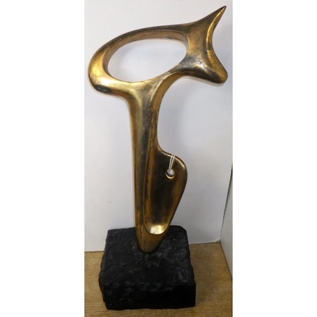 An abstract bronze sculpture on a marble base