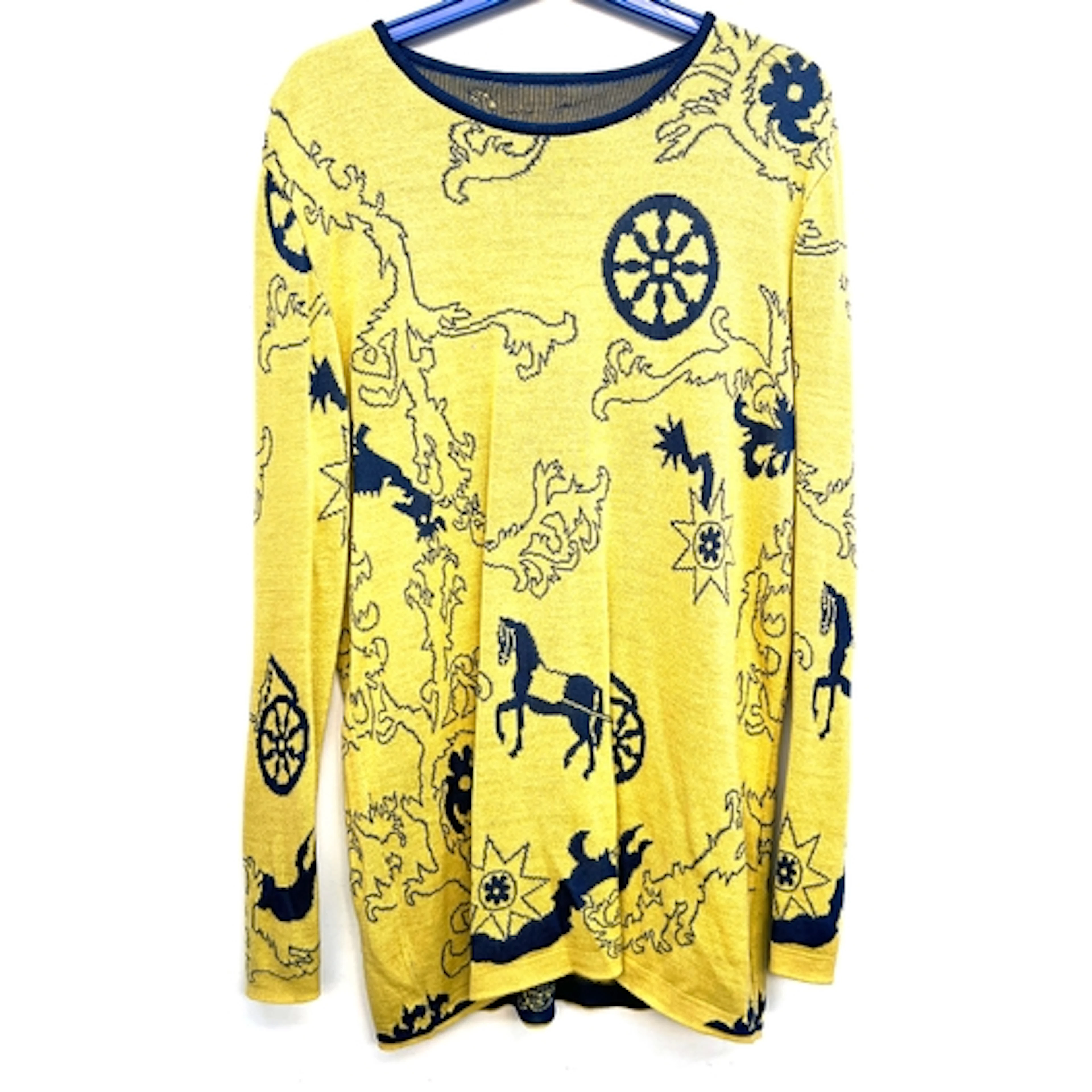 A yellow and blue jumper in an Hermes style pattern depictin...