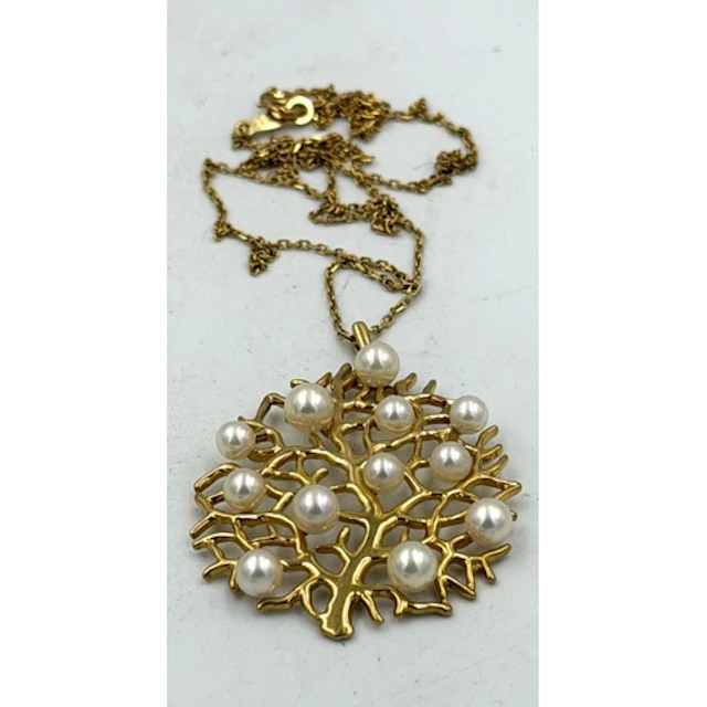 An 18ct gold tree themed pendant set with pearls on a fine 1...