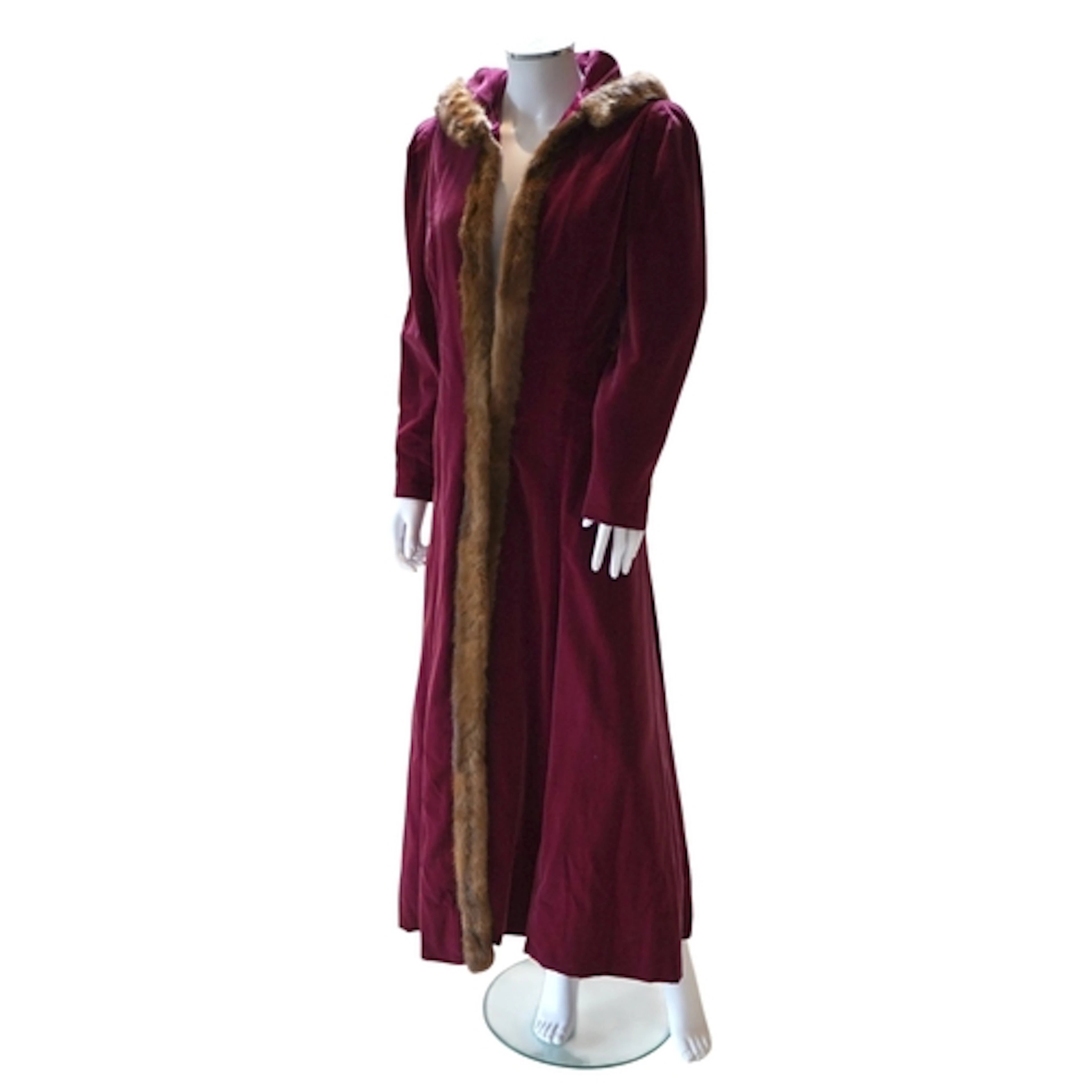 A mink trimmed burgundy coloured velvet hooded evening coat ...
