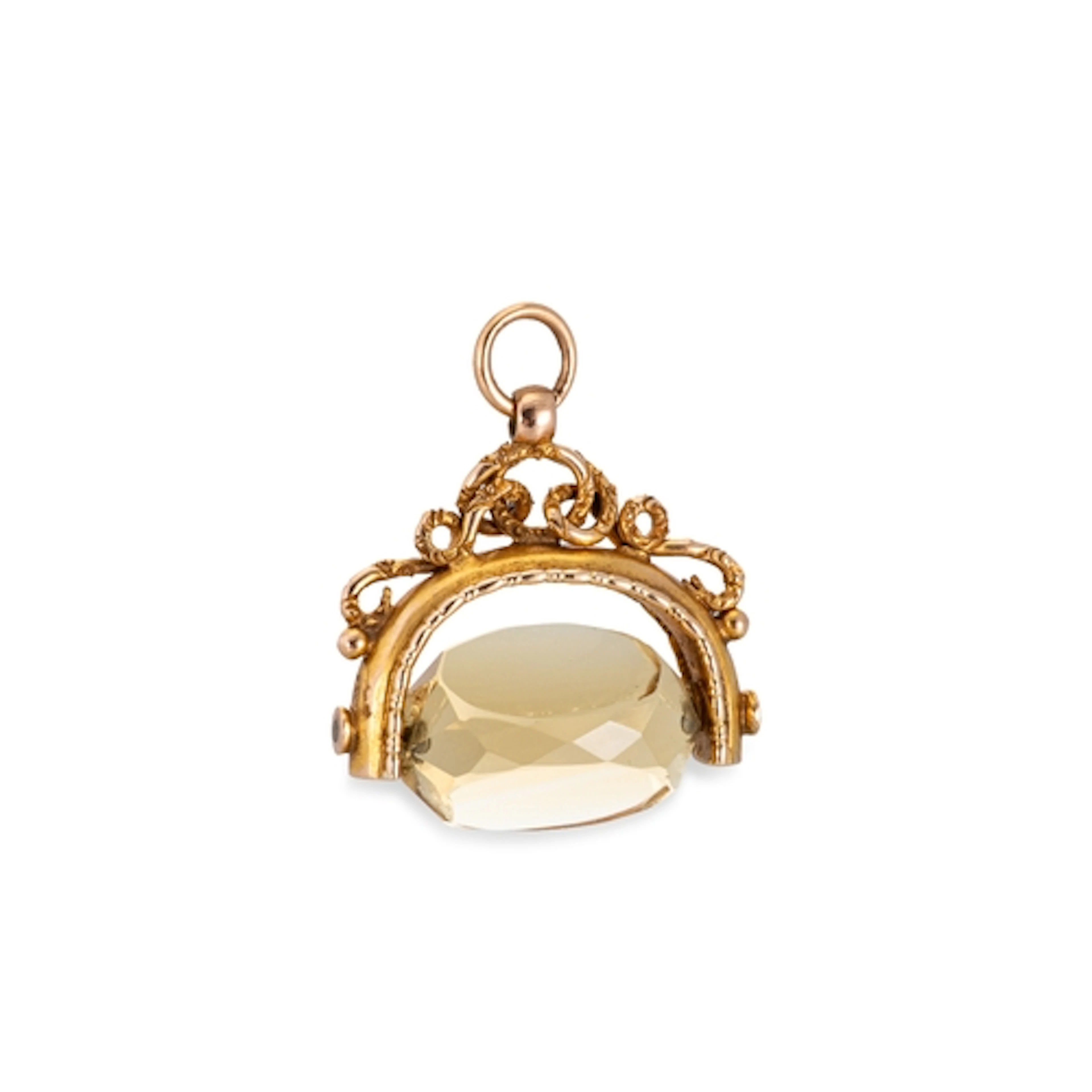AN ANTIQUE SWIVEL GOLD FOB, quartz set, in 9ct gold