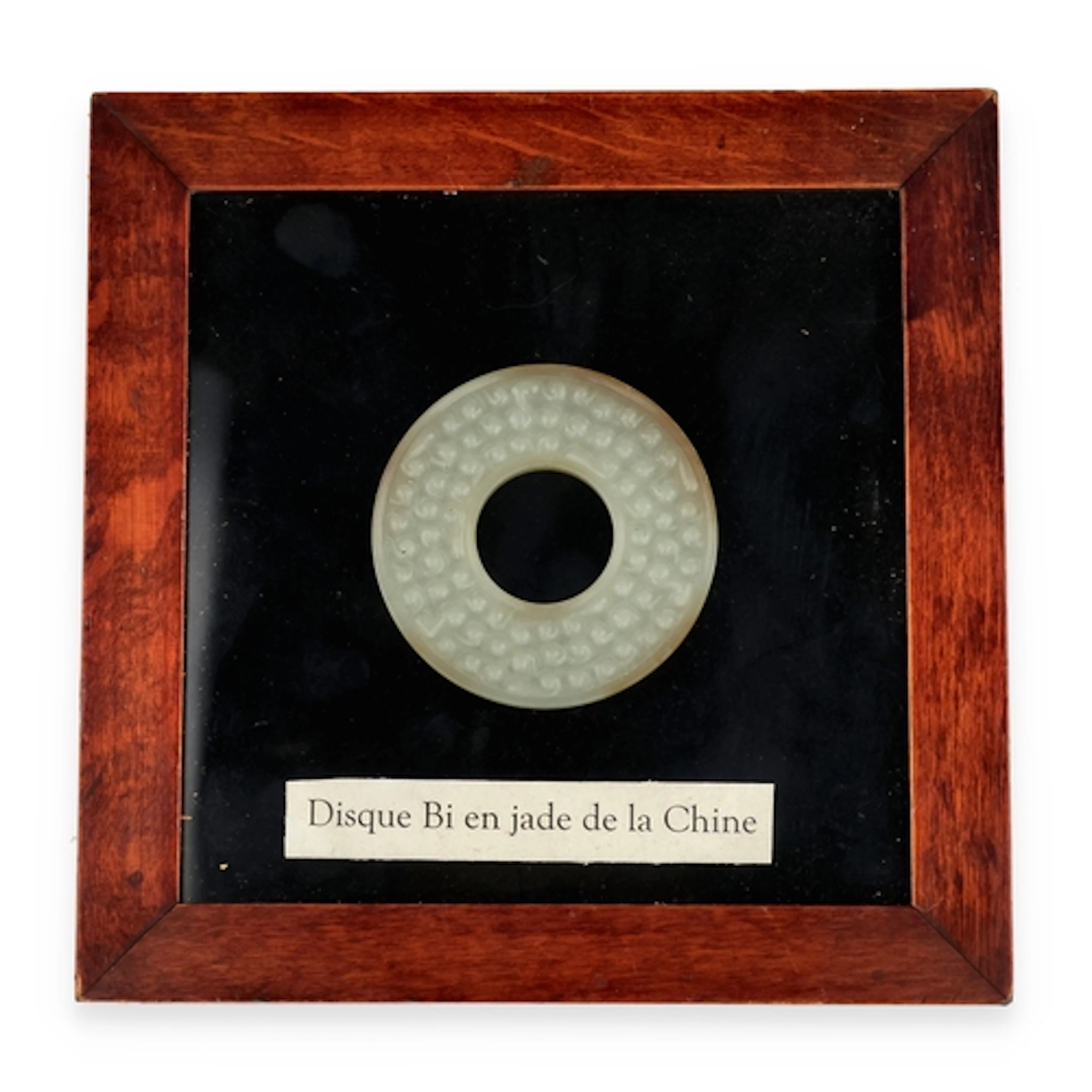 A CHINESE JADE BAI Probably Qing dynasty. 53mm across. Mount...