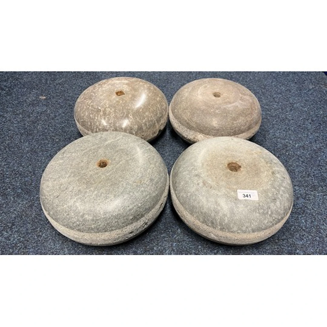 Group of four curling stones.