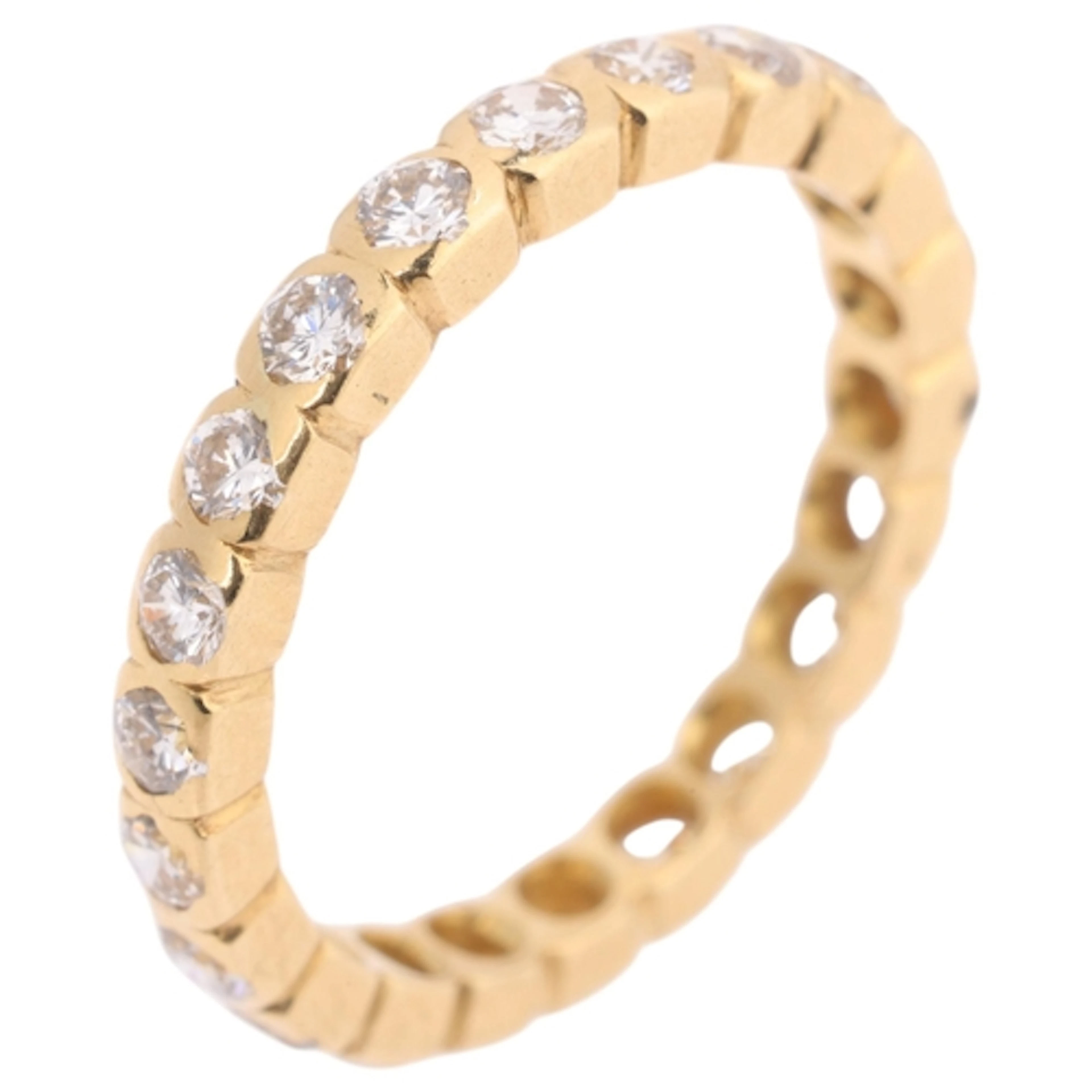 An 18ct gold diamond full eternity ring, set with modern rou...
