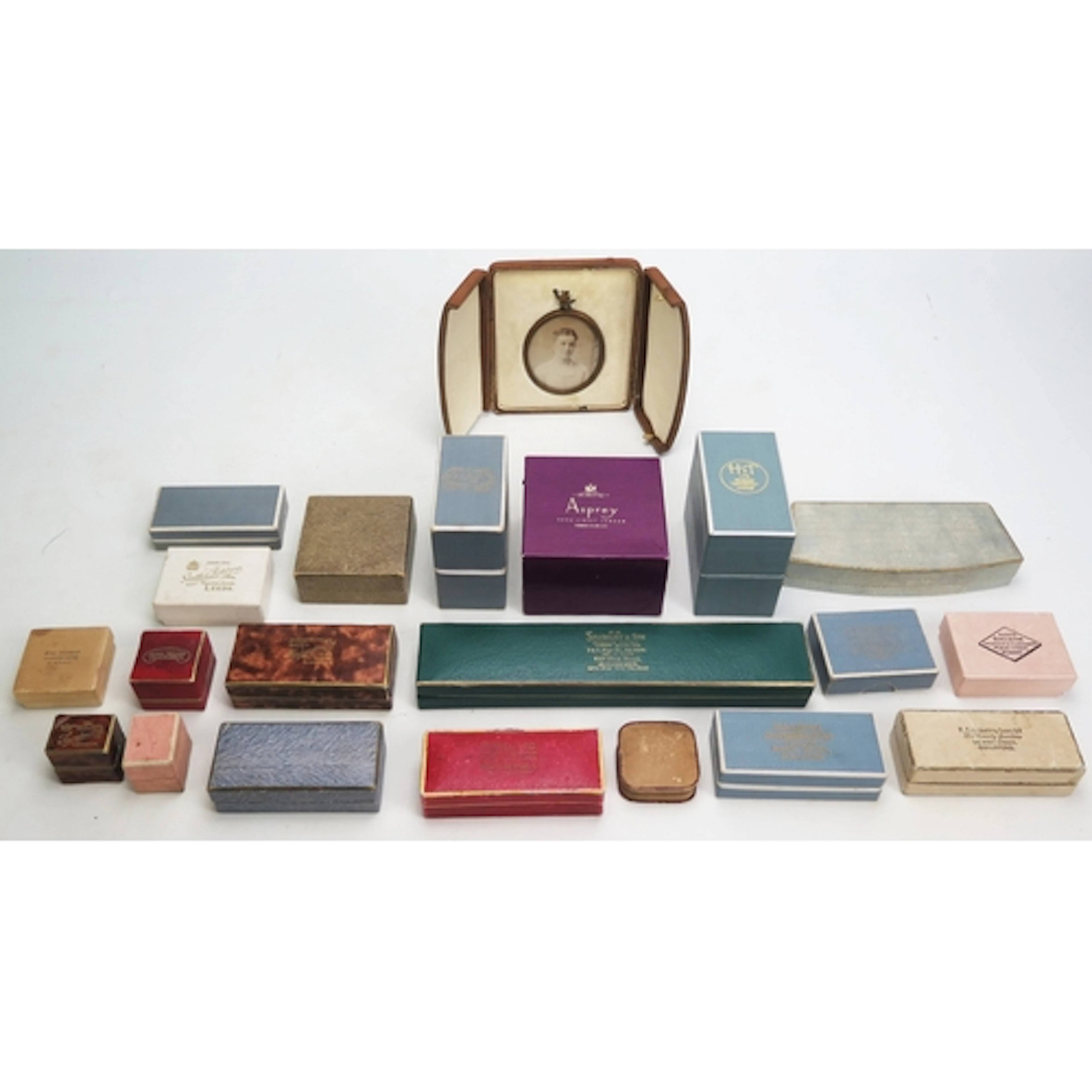 A selection of jewellery boxes including a cased photographi...