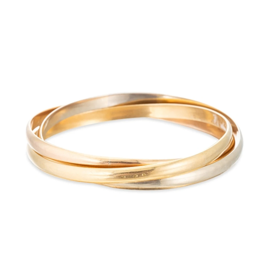 A CARTIER TRINITY BANGLE, in large model of three colour gol...