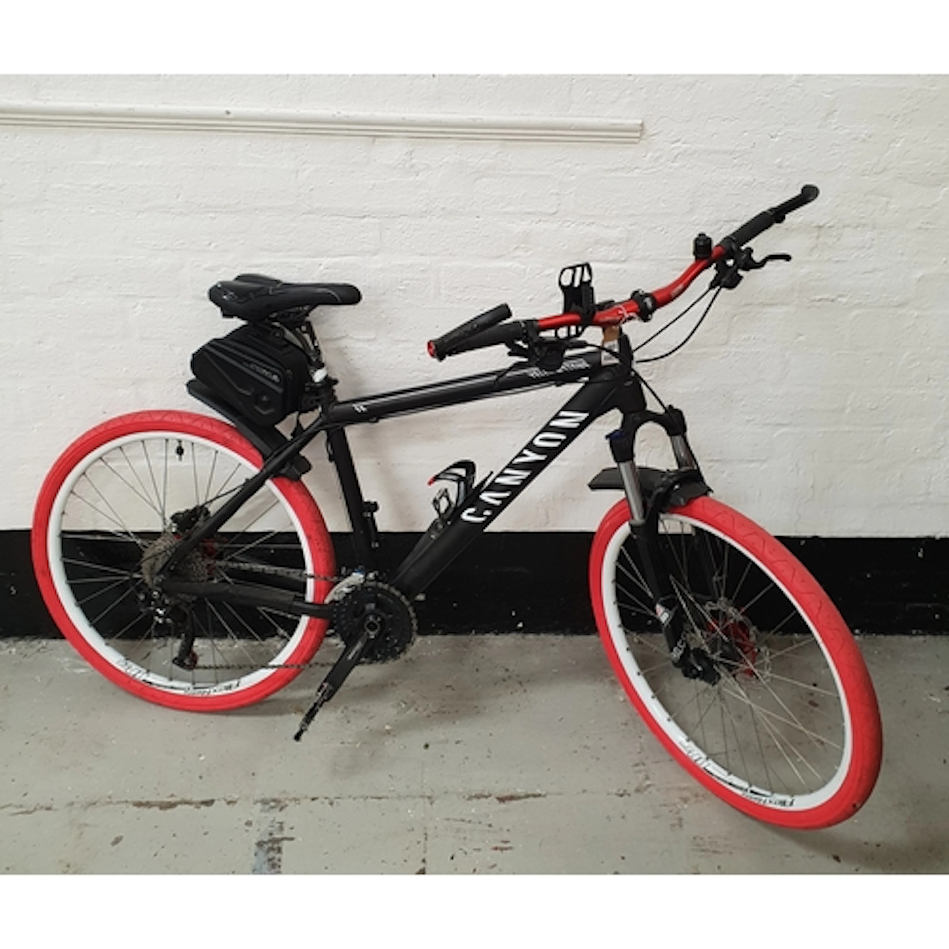 ONE BLACK CANYON MOUNTAIN BIKE CUSTOMISED WITH BRIGHT PINK T...