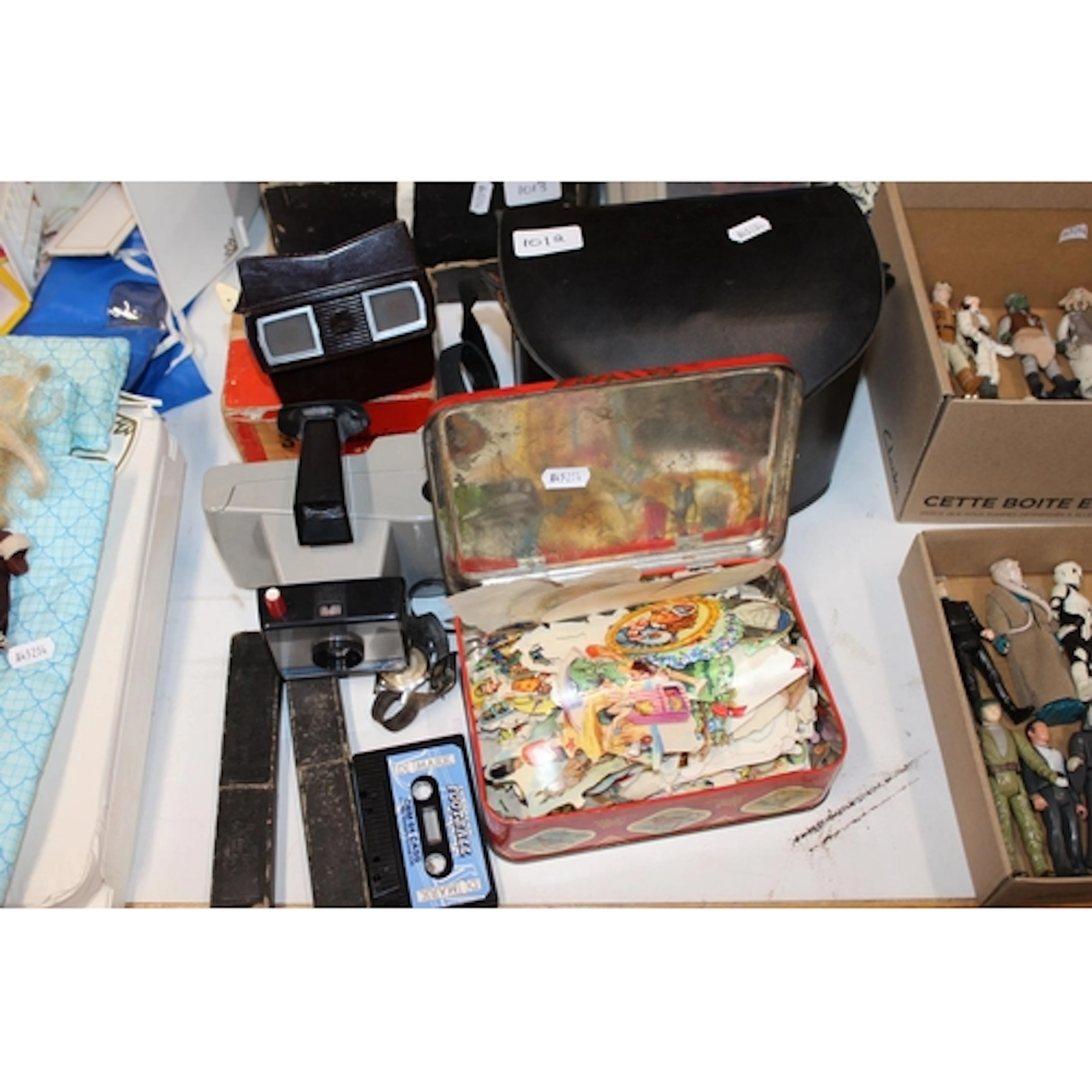 Vintage tin containing scraps, Polaroid Swinger II Land Came...