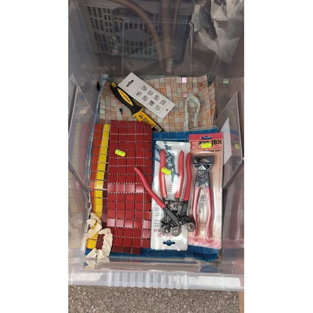 A quantity of mesh-backed mosaic tiles in red, blue, yellow ...