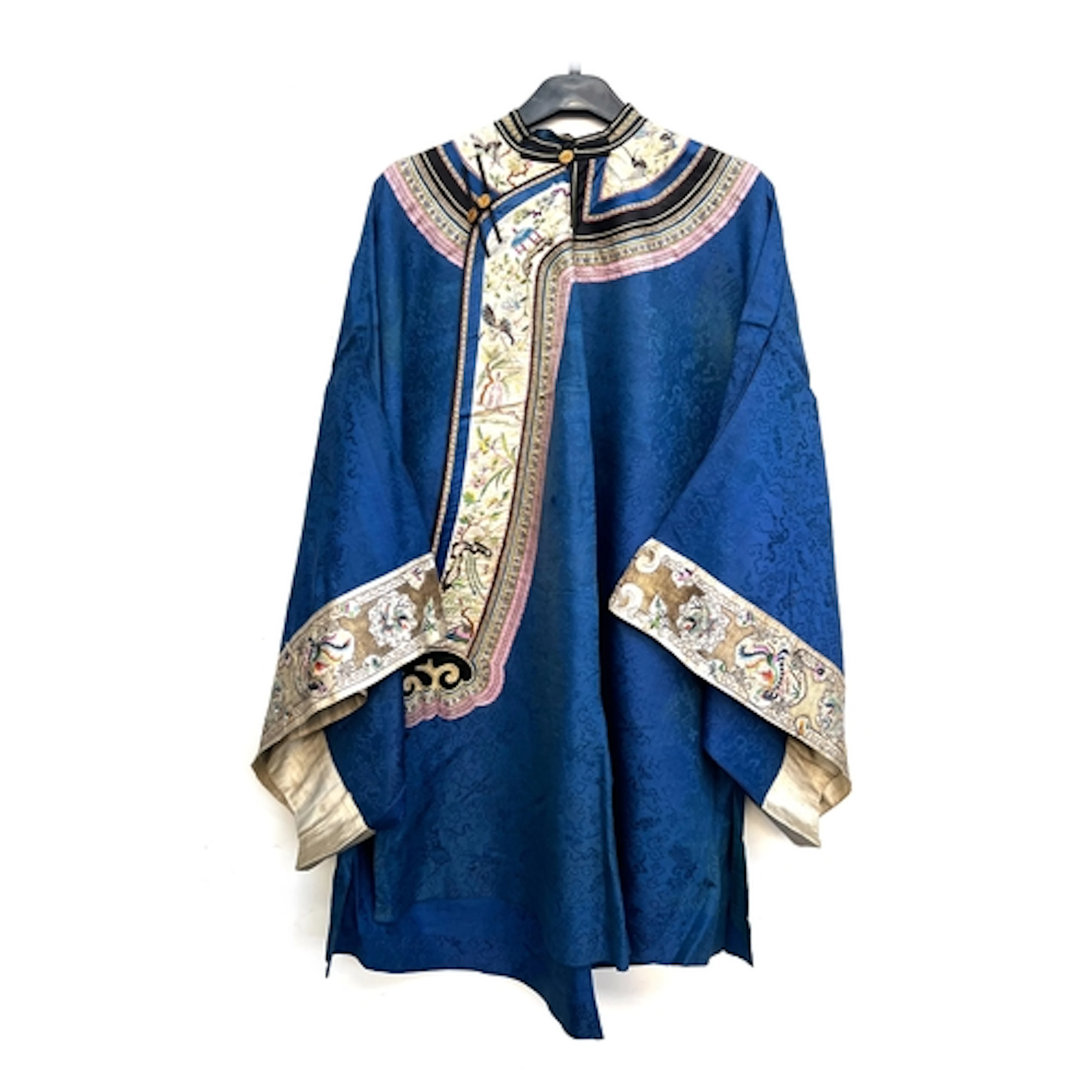 An antique Chinese ladies blue silk robe, the damask silk wi...