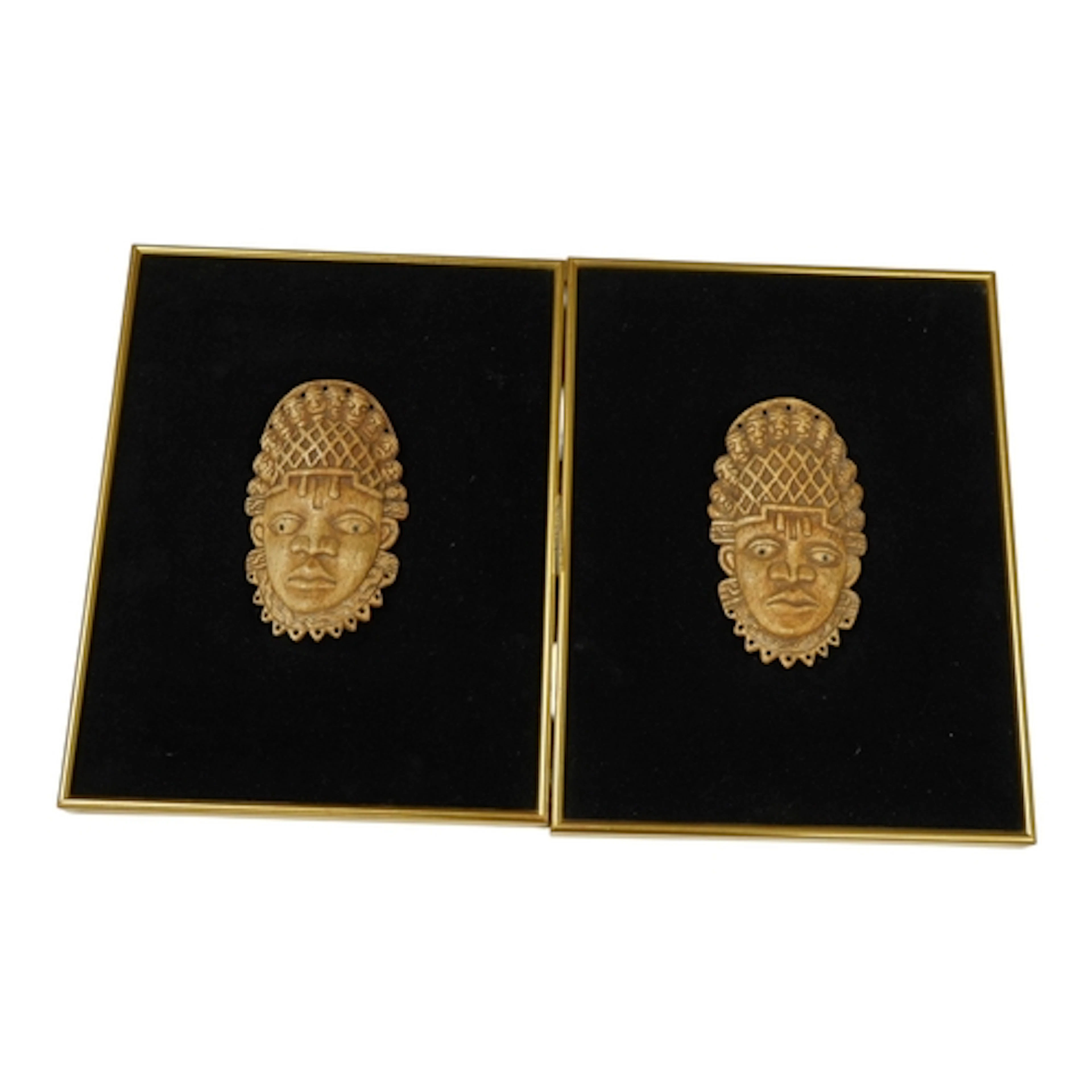 Two Nigerian bone Queen Mother masks, length 16cm, framed, 3...