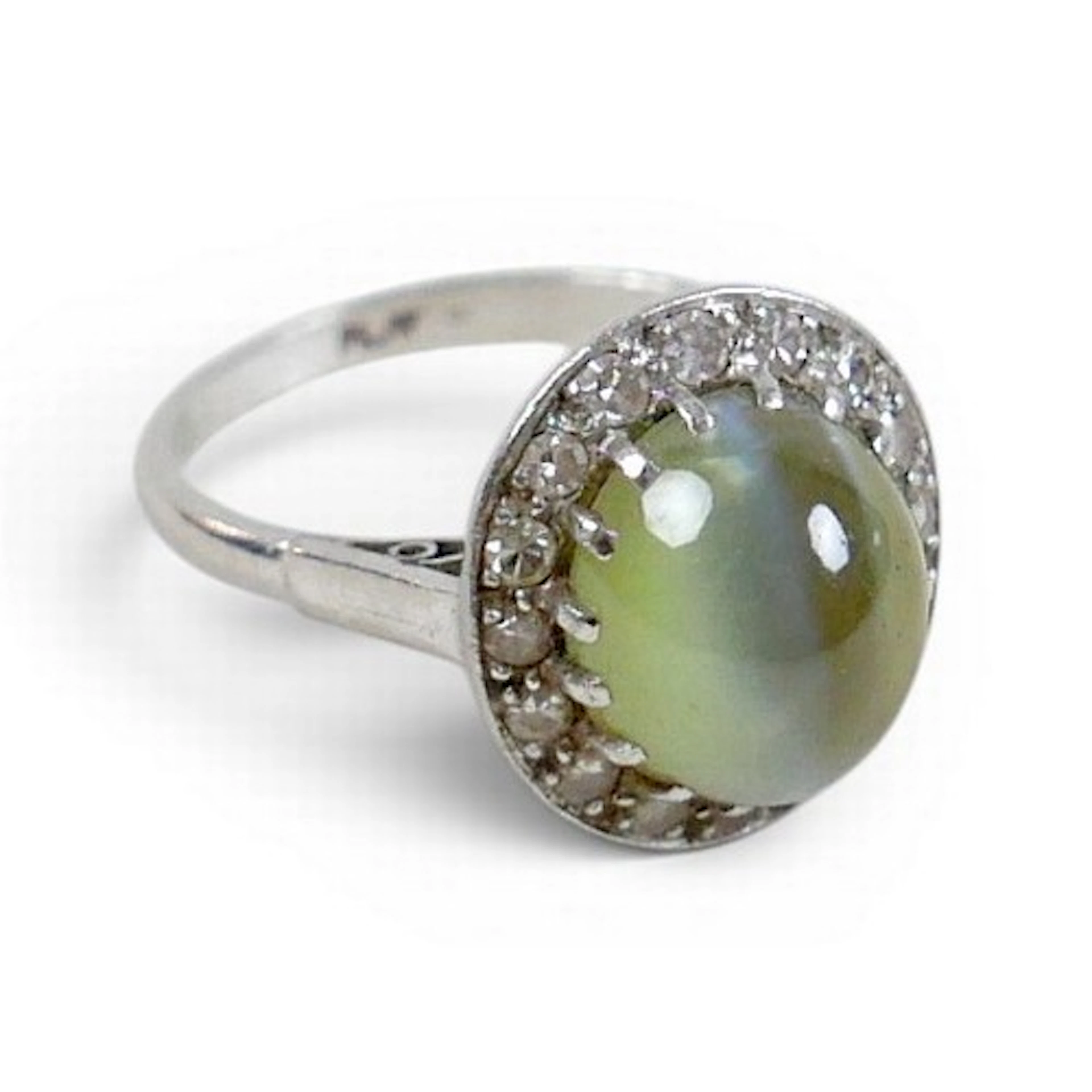 A platinum and chrysoberyl ring, the oval cabochon cut stone...
