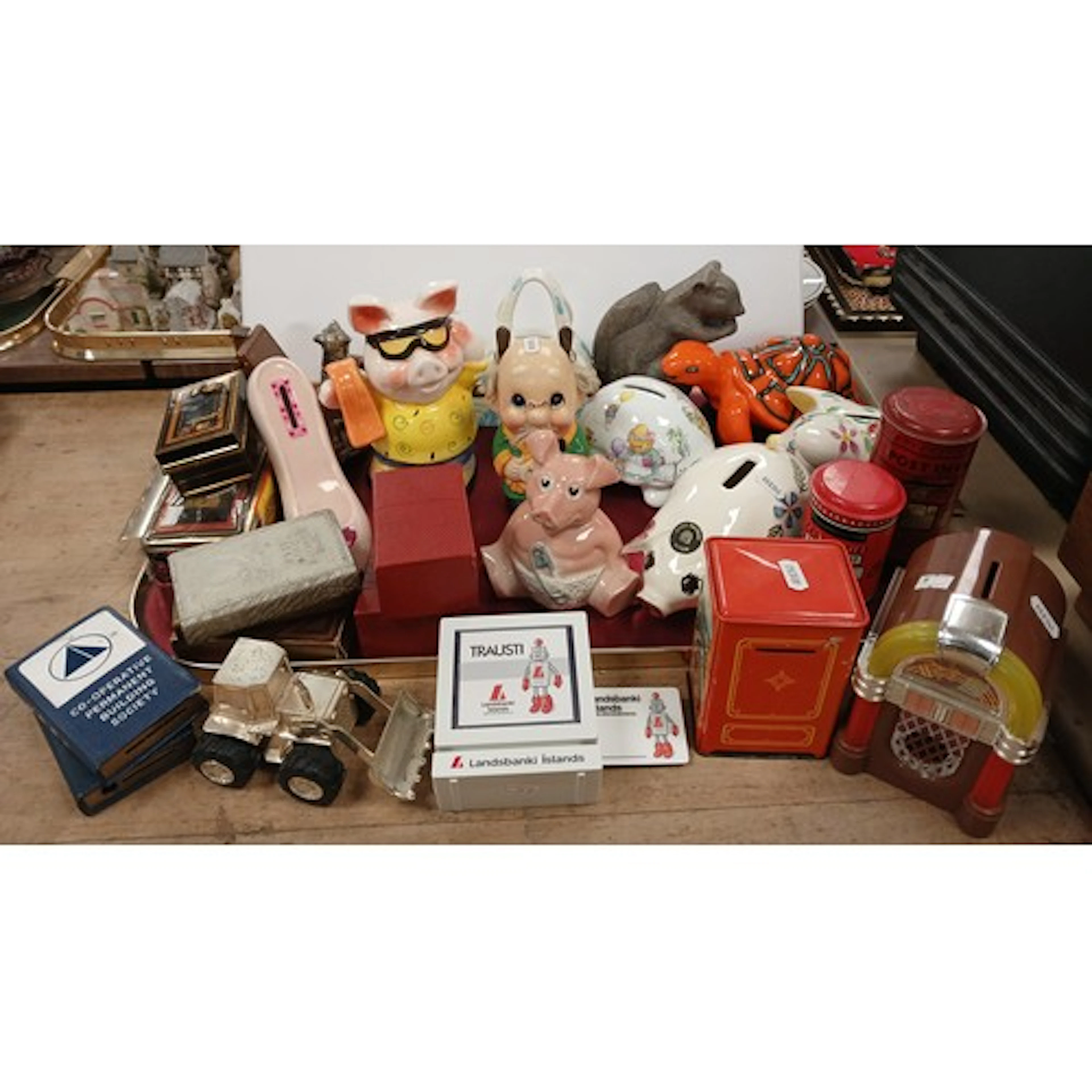 Collection of novelty money boxes to include Co-op, pigs, to...