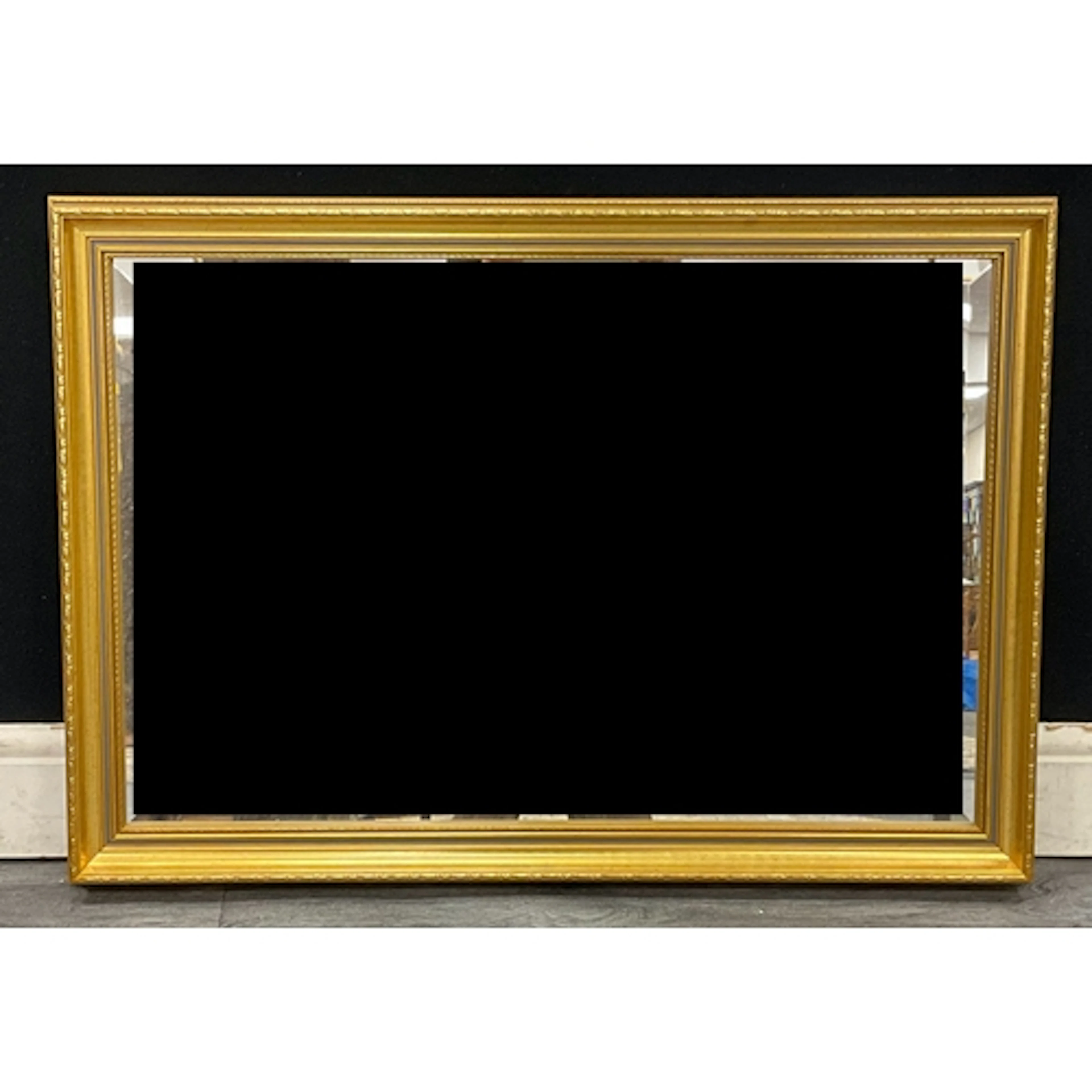 A contemporary gilt framed rectangular mirror, 60cm high, 64...