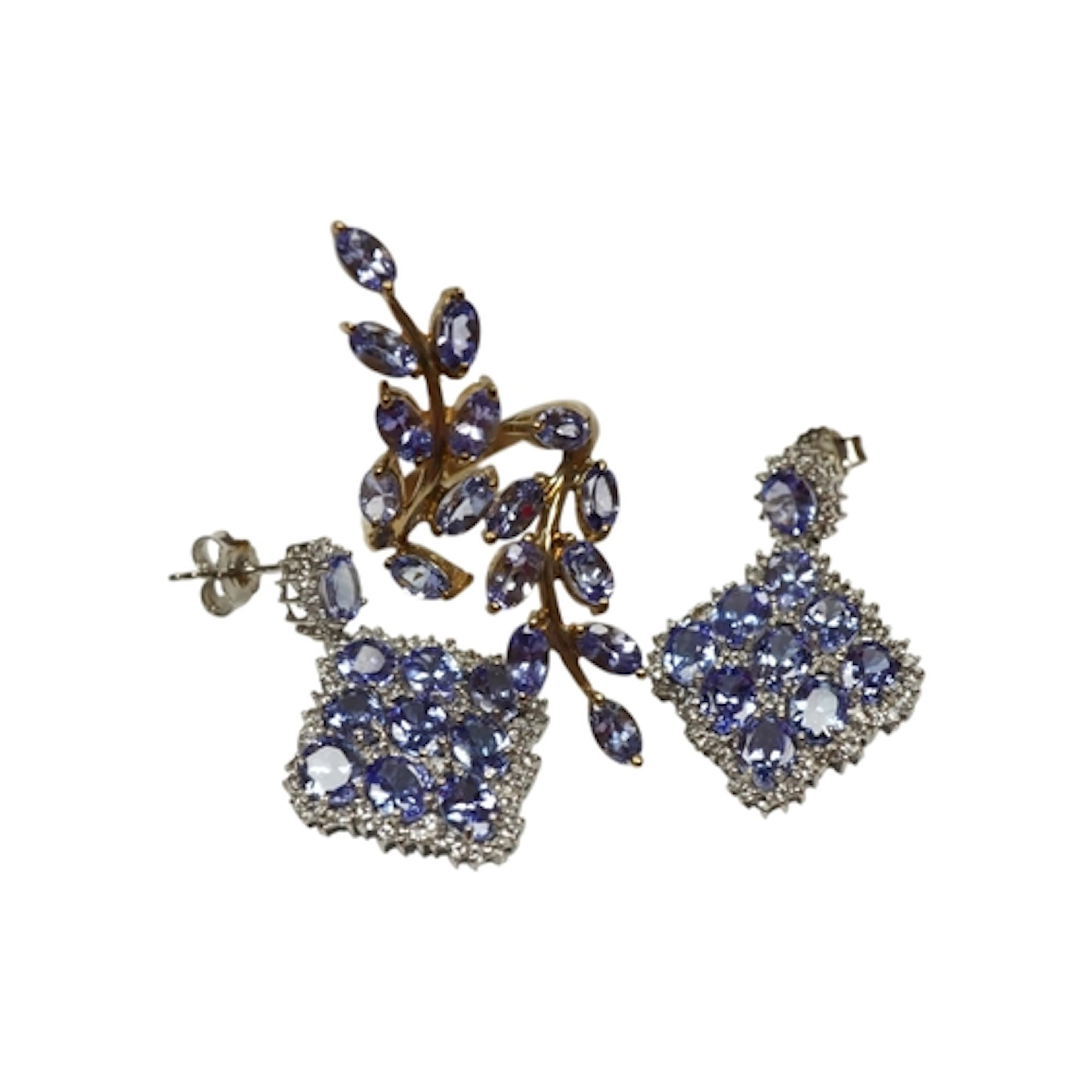 A recent 9ct gold and tanzanite cluster up-finger ring, of f...