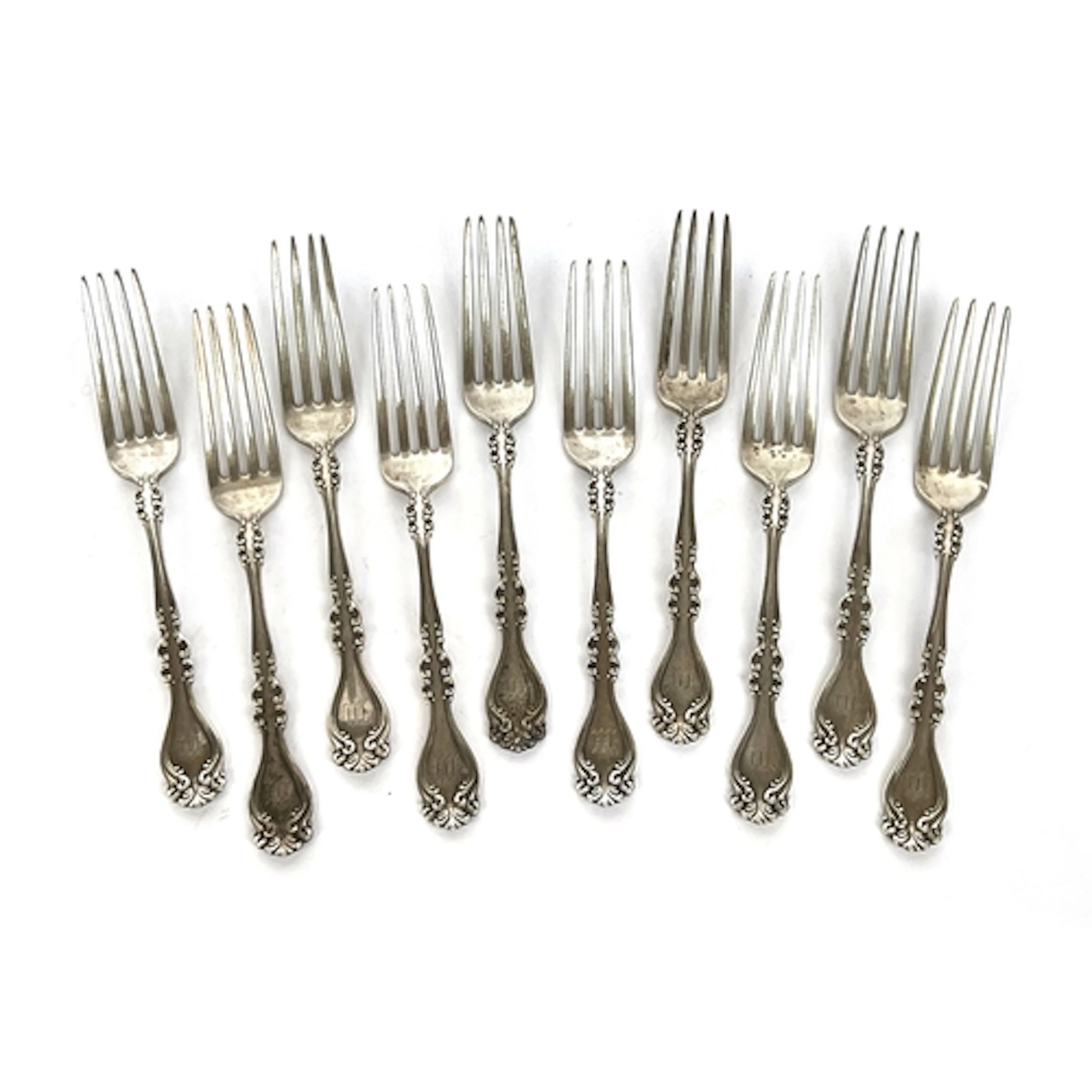 A lot of ten sterling silver dessert forks, 484g