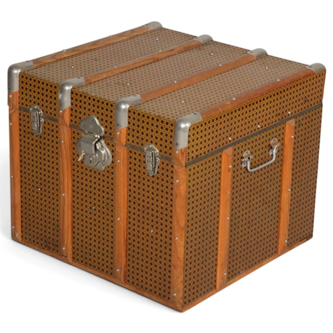 A 1950s' trunk, with tin coating in wicker form, hardwood st...