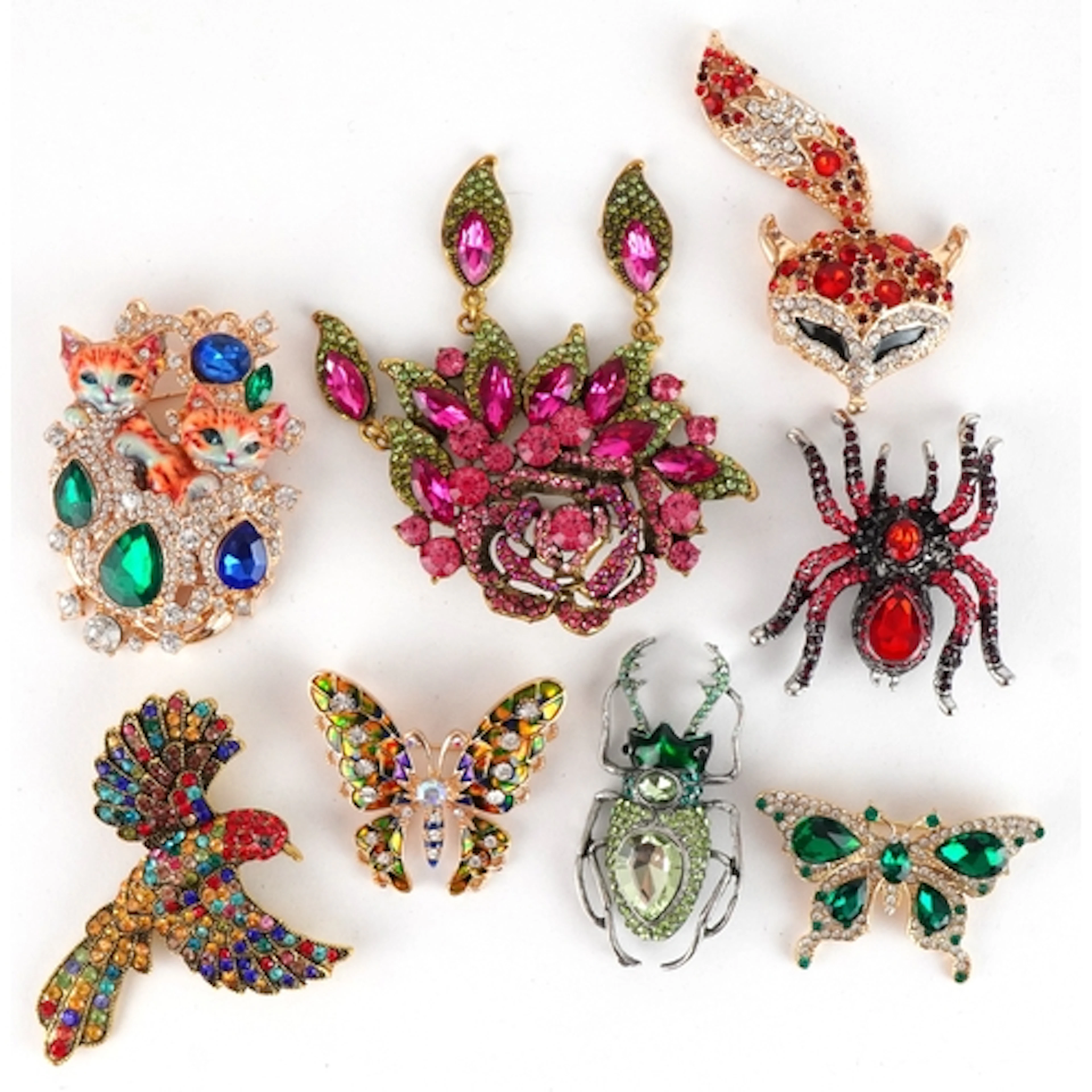 Eight decorative jewelled brooches, some with enamel, includ...