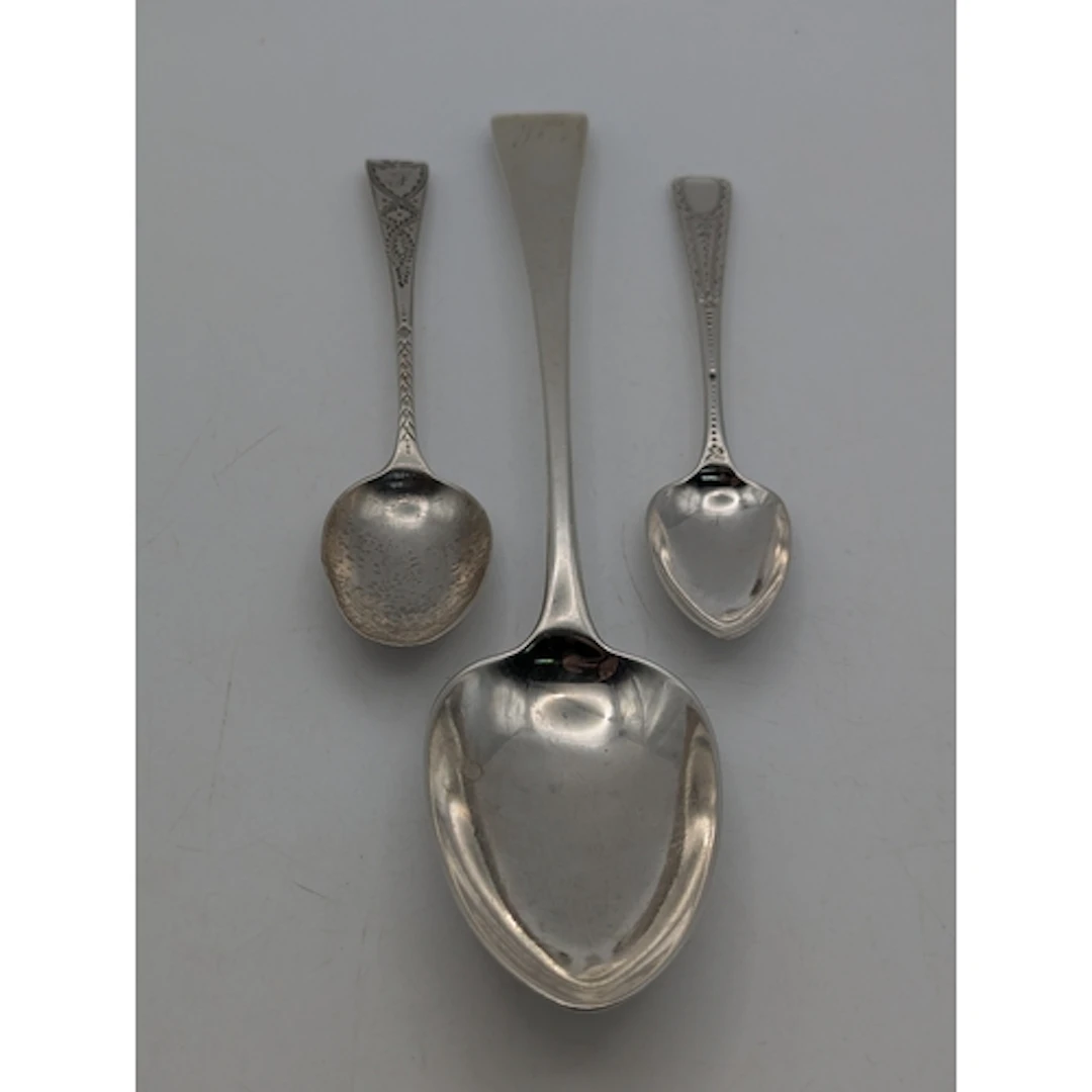 Three silver spoons to include a George III tablespoon havin...