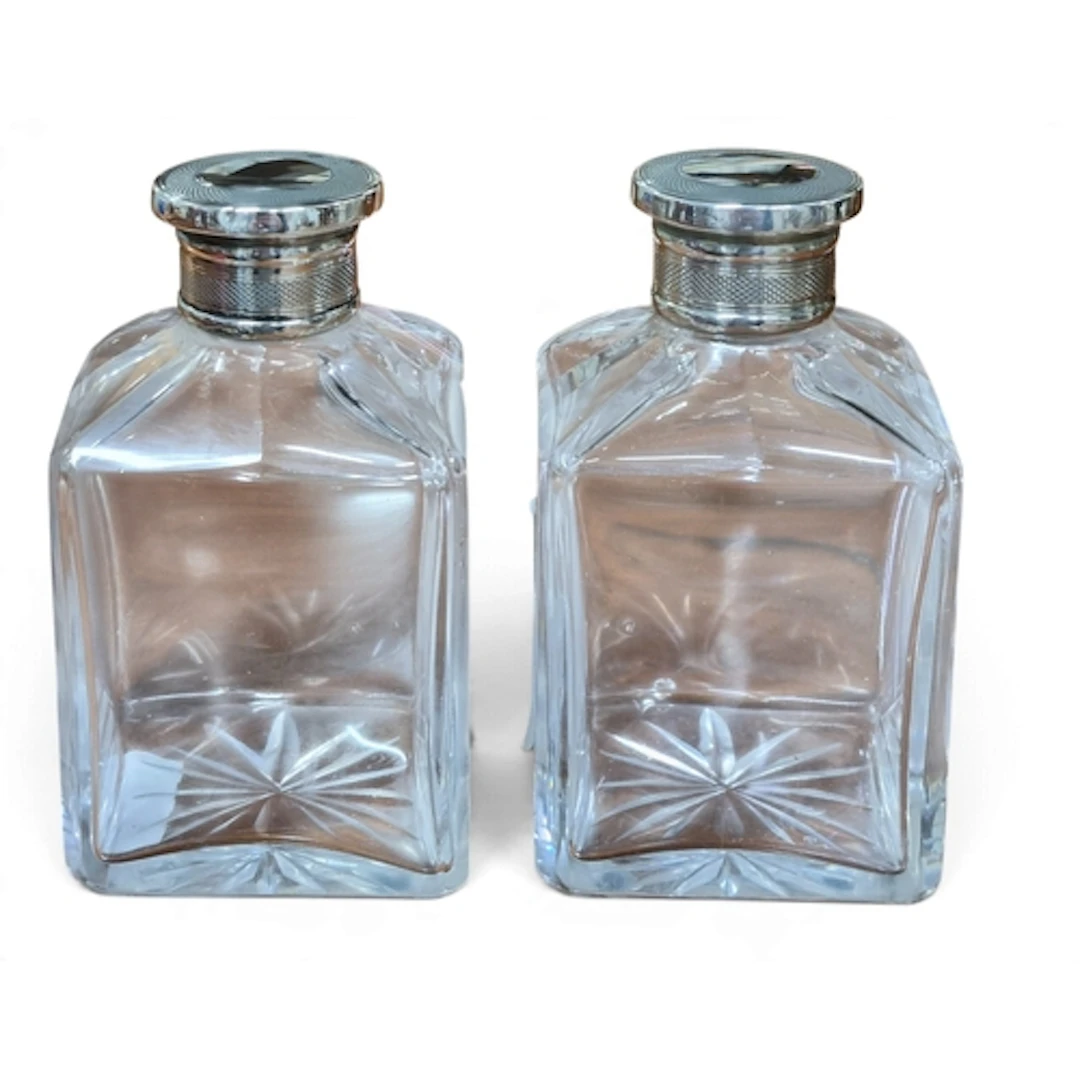 A lovely pair of cut Glass dressing table perfume Bottles wi...
