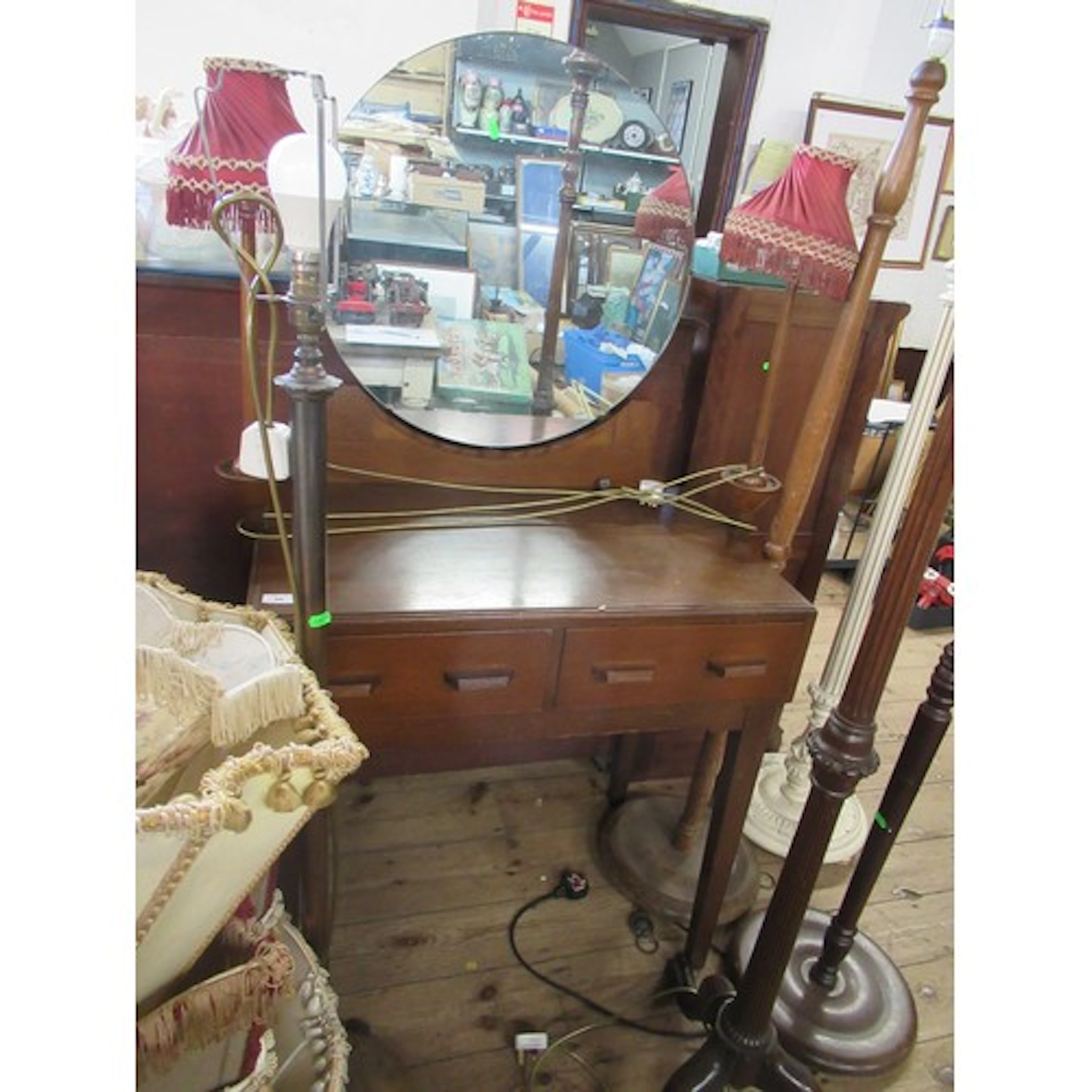 A dressing table together with various standard lamps
