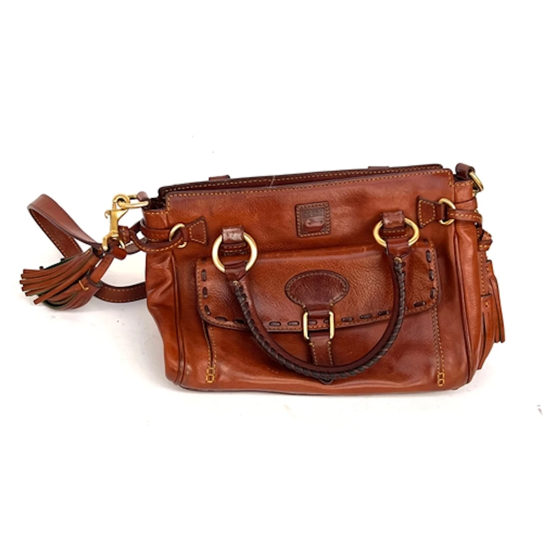 A Dooney Bourke brown leather handbag with tassels, 32cmW