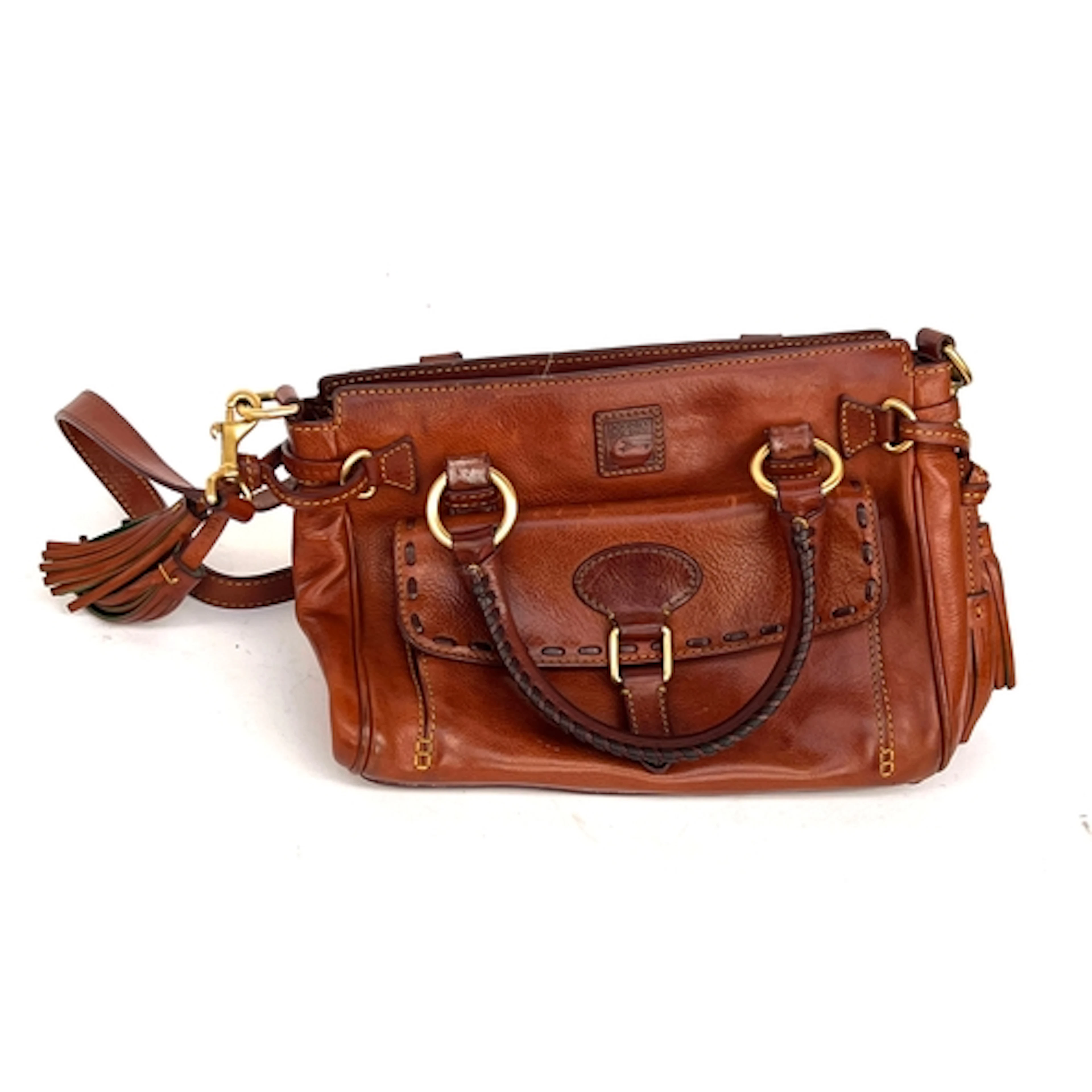 A Dooney Bourke brown leather handbag with tassels, 32cmW