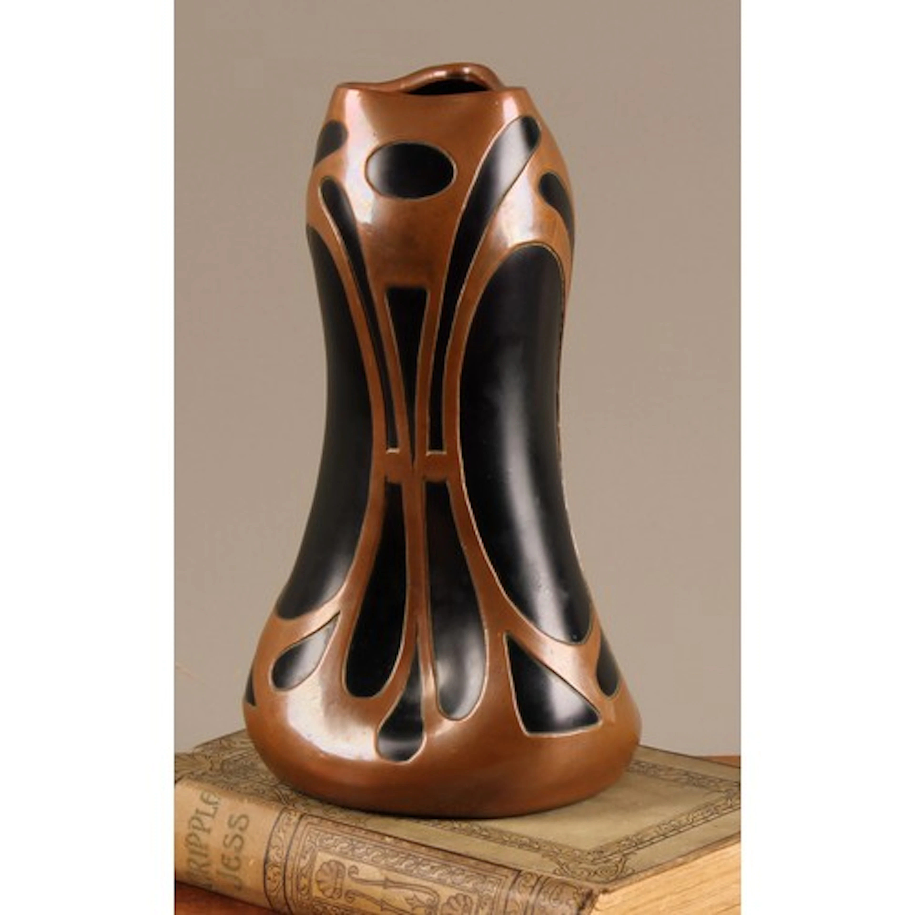 An Art Nouveau copper mounted iridescant amethyst glass vase...