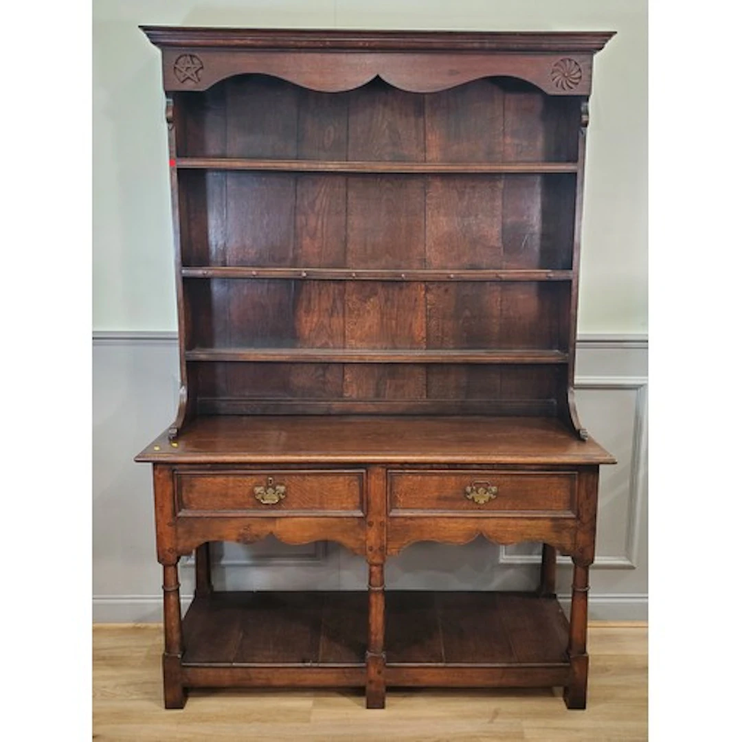 An oak Dresser and Rack, the rack with moulded cornice and s...