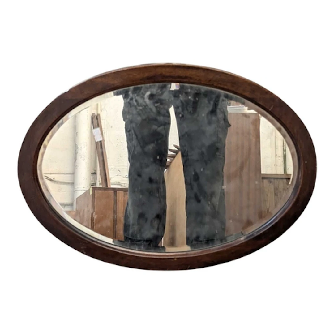 A vintage 20th century Art Deco hanging wall mirror. Oval fo...