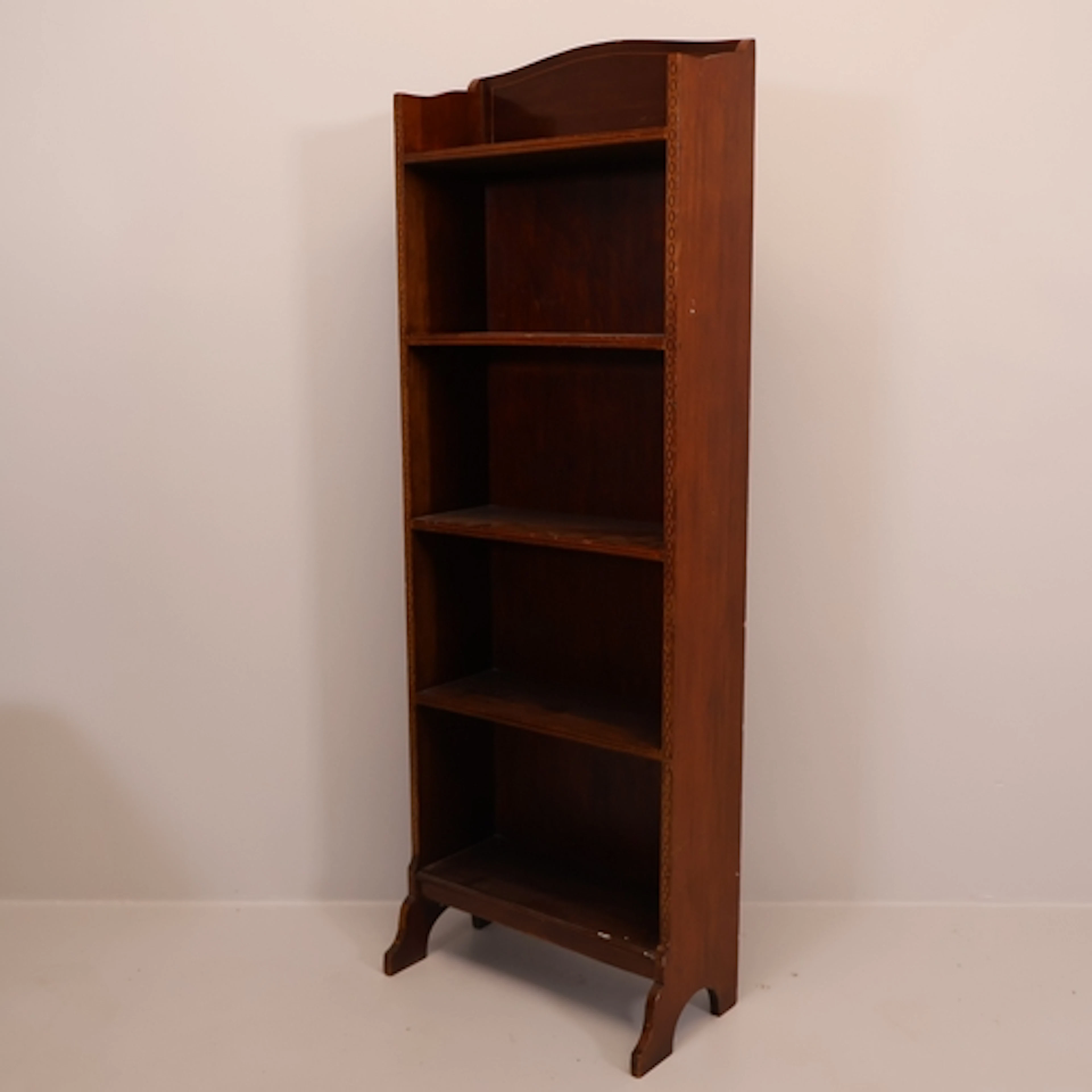 An Edwardian mahogany and satinwood strung open bookcase, wi...