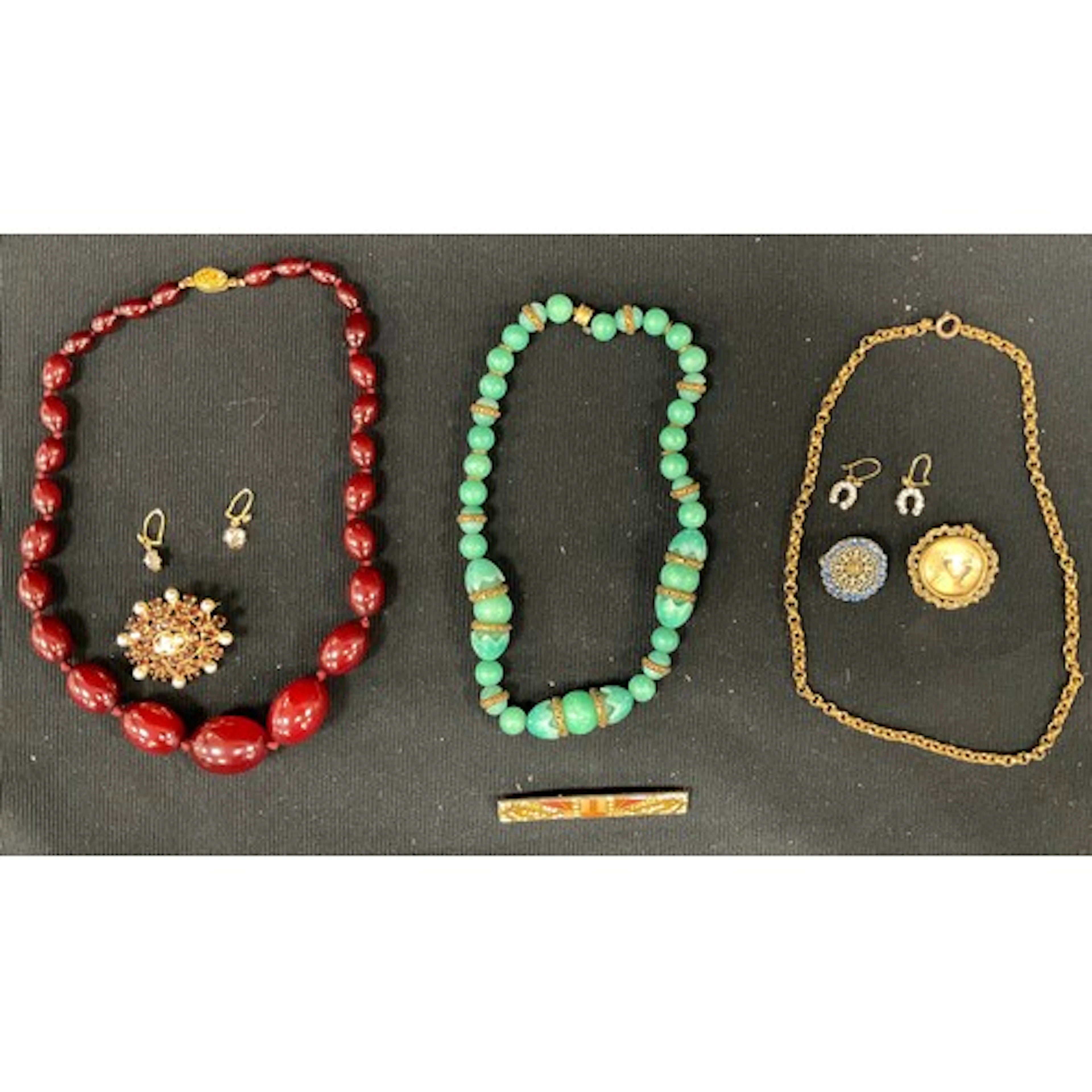 A small collection of costume jewellery, to include a cherry...