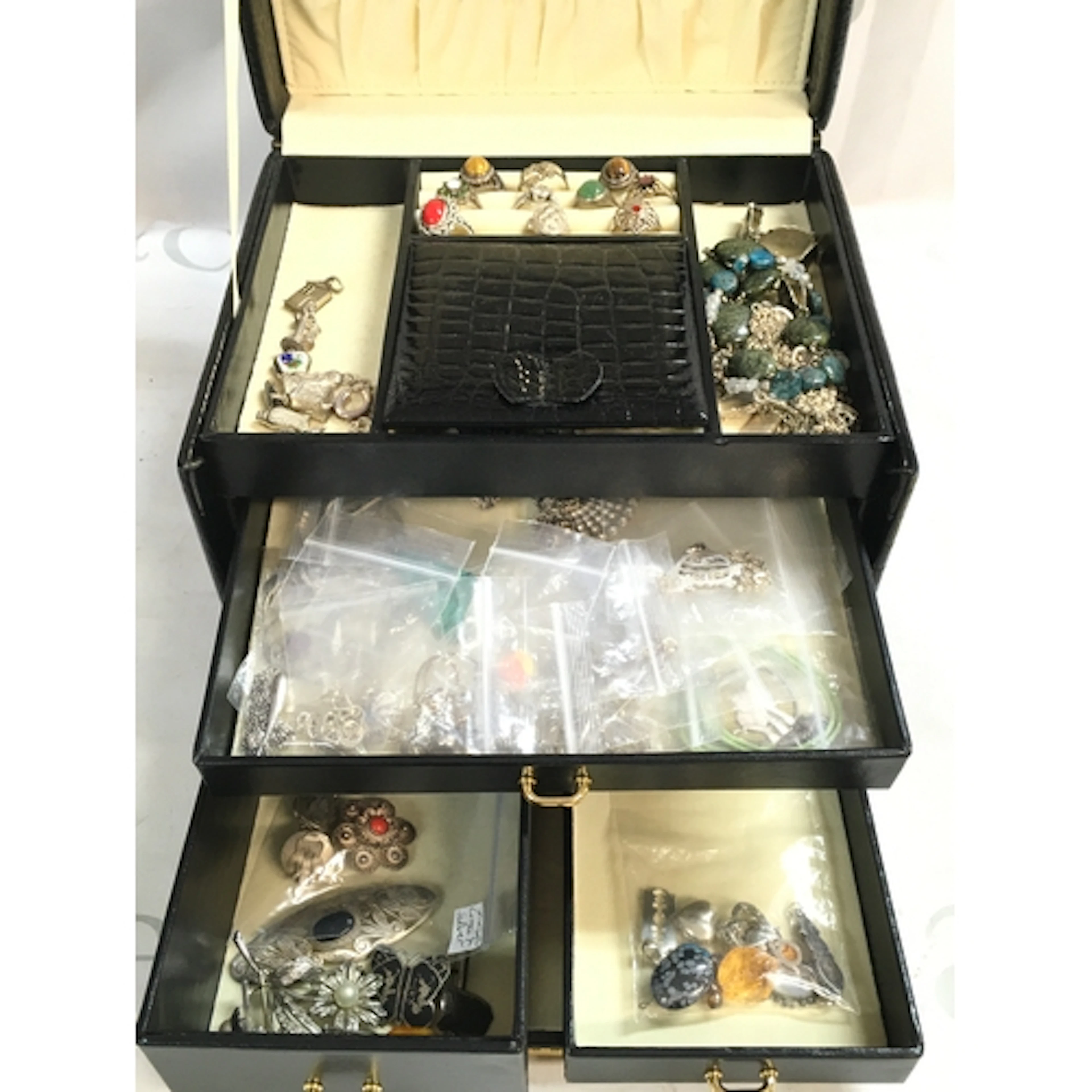 Black jewellery box including all silver 20 necklaces, 10 ch...