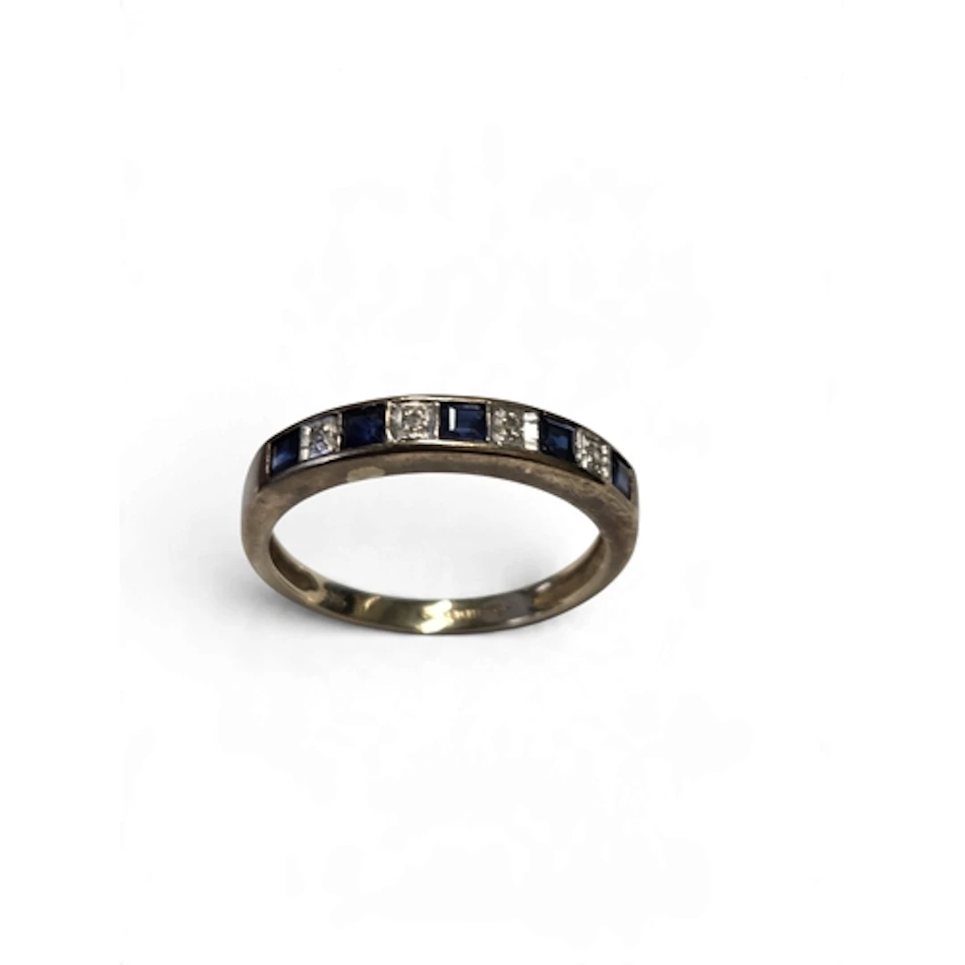 An attractive 9-carat gold sapphire and diamond channel-set ...