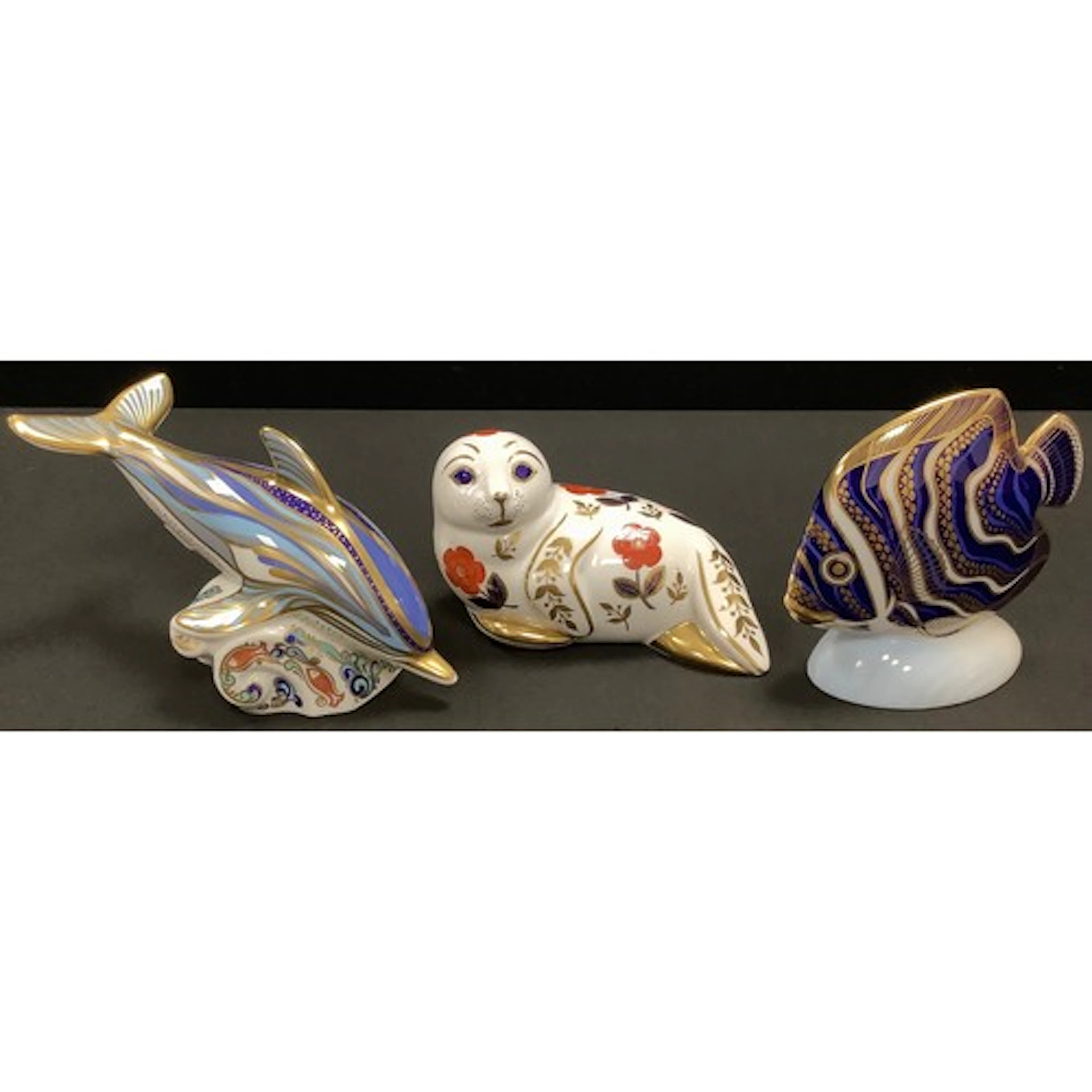 A Royal Crown Derby paperweight, Striped Dolphin, a gold sig...
