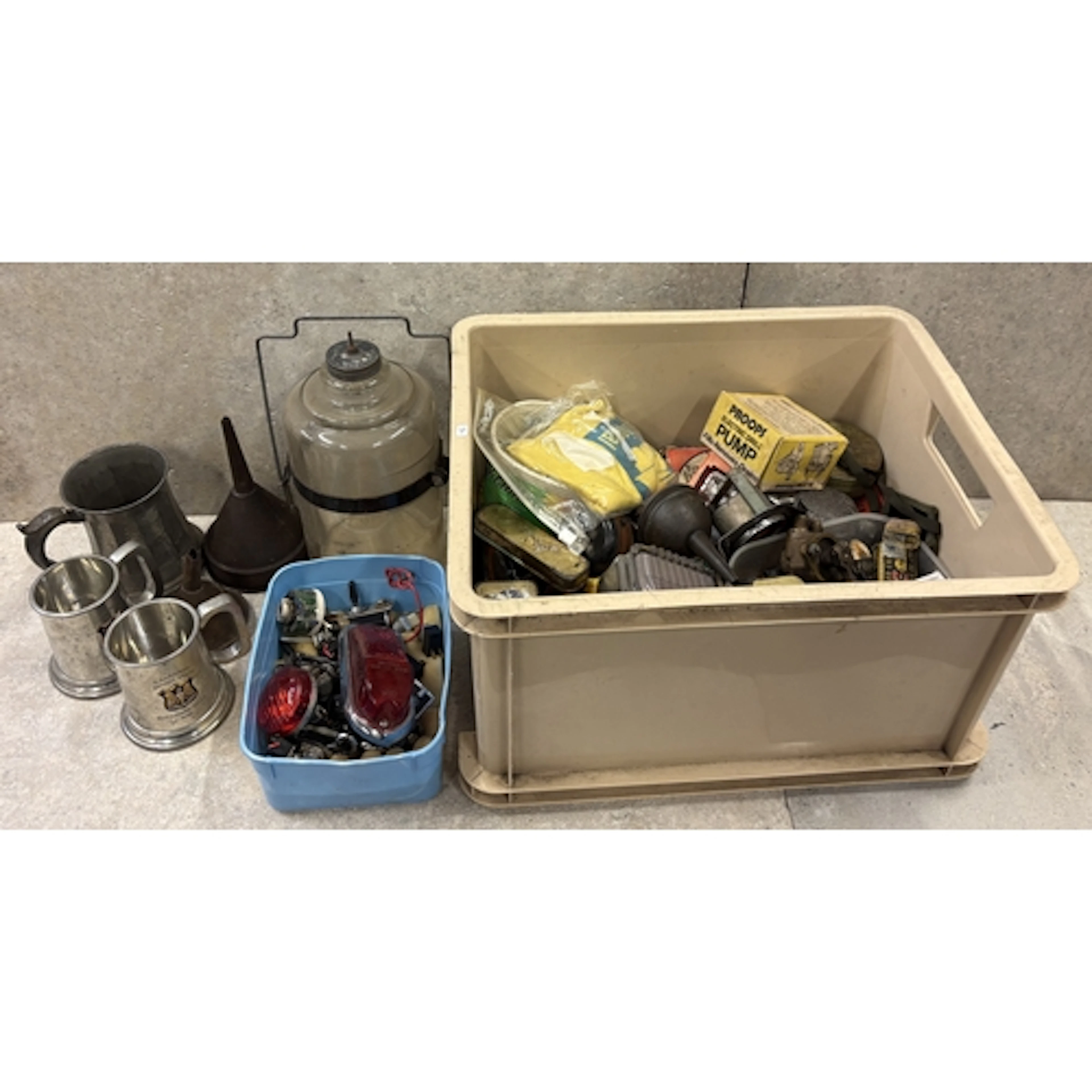 A box of motoring wonderments including spirit funnels, swit...