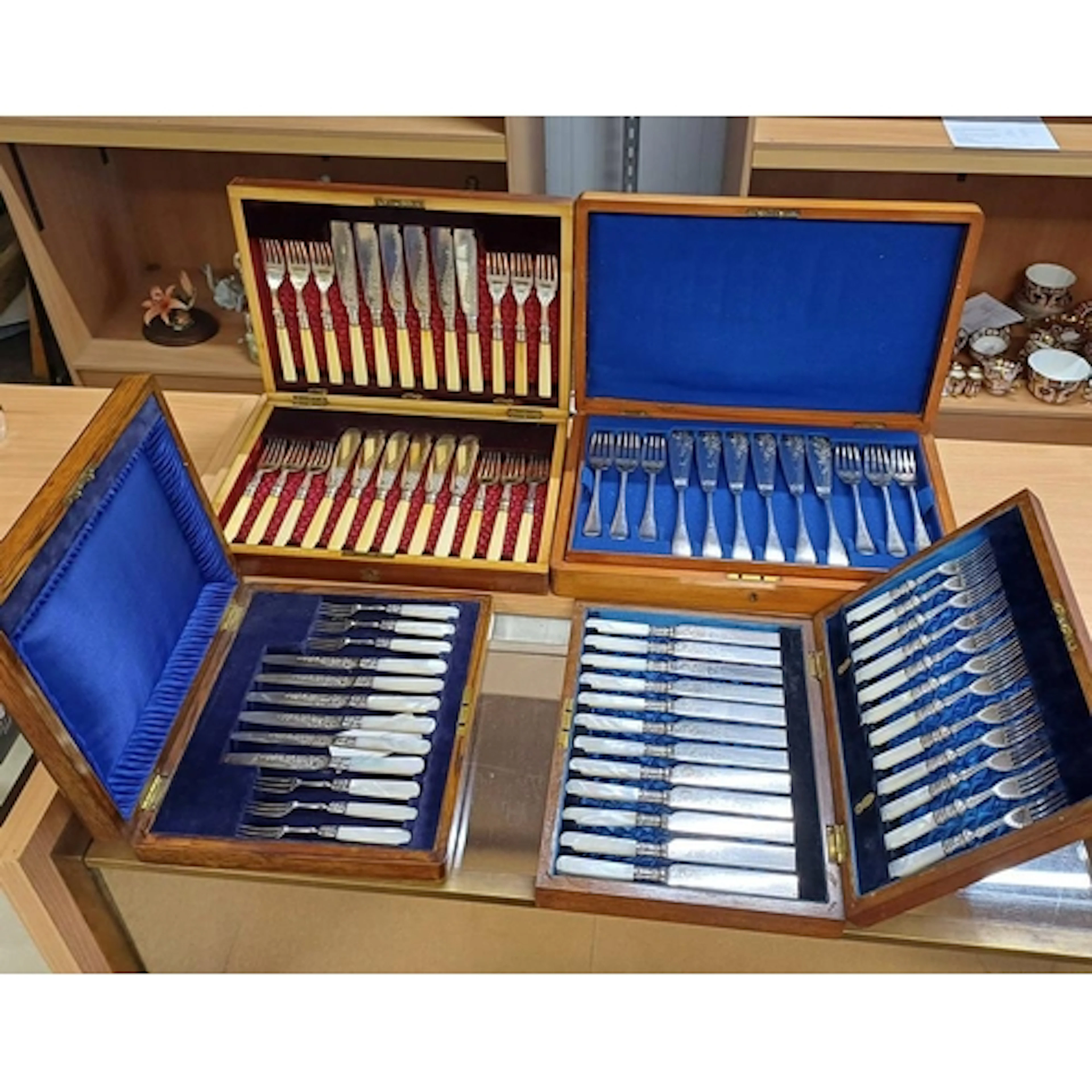 4 CANTEENS OF SILVER PLATED CUTLERY, ONE WITH SILVER BANDS