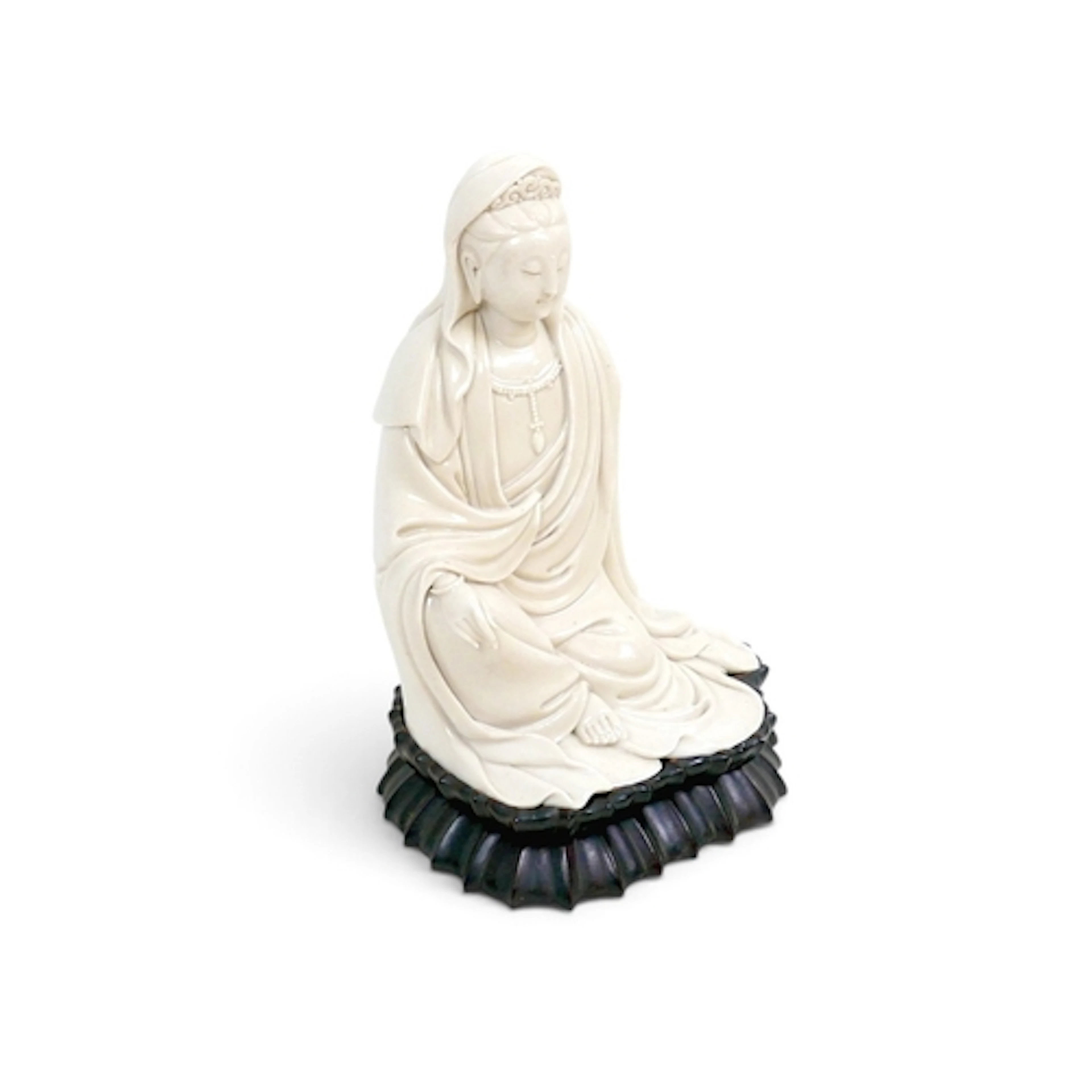 AN EARLY 20TH CENTURY BLANC-DE-CHINE FIGURINE OF GUANYIN. th...