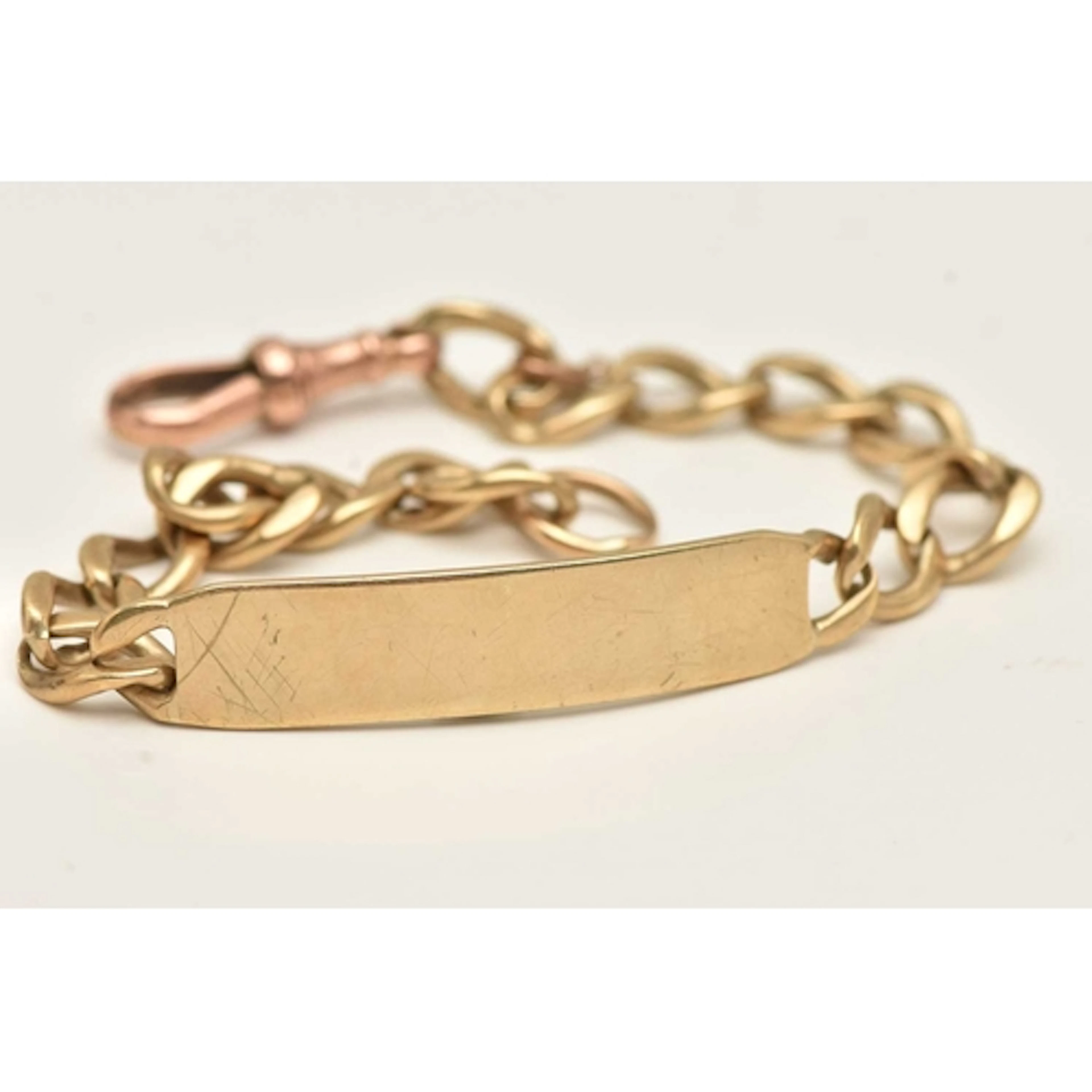 A 9CT GOLD IDENTIFICATION BRACELET, polished panel hallmarke...